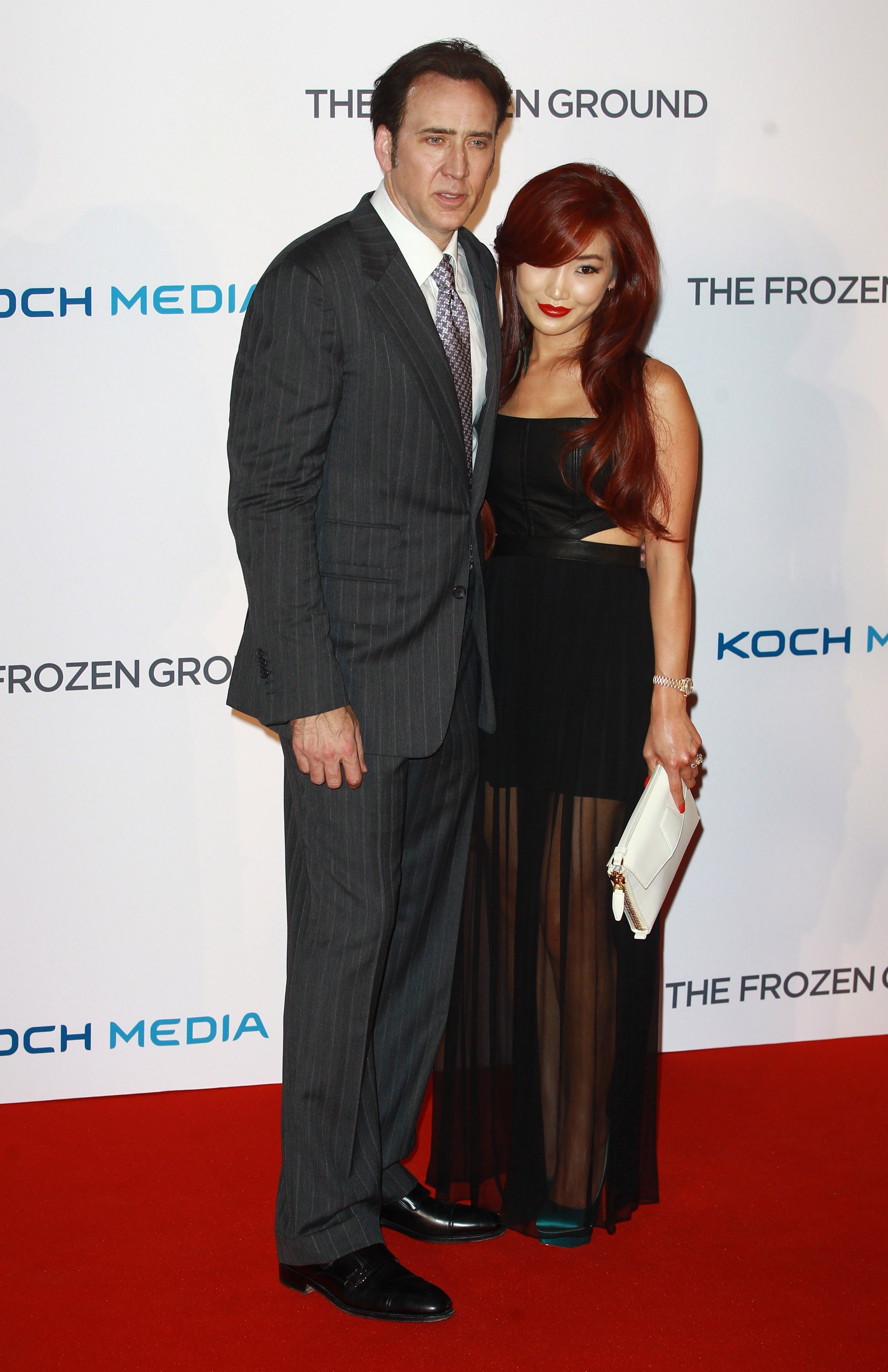 Alice Kim and Nicolas Cage the premiere of "The Frozen Ground" in London, England on July 17, 2013 | Source: Getty Images 