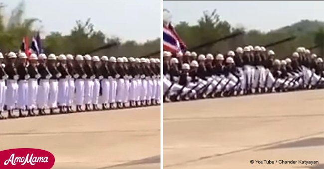 Soldiers line up in unison, but after the music starts to play they create wild visual effects