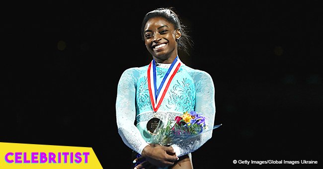 Simone Biles heats it up on the beach wearing pink bikini after making gymnastics history