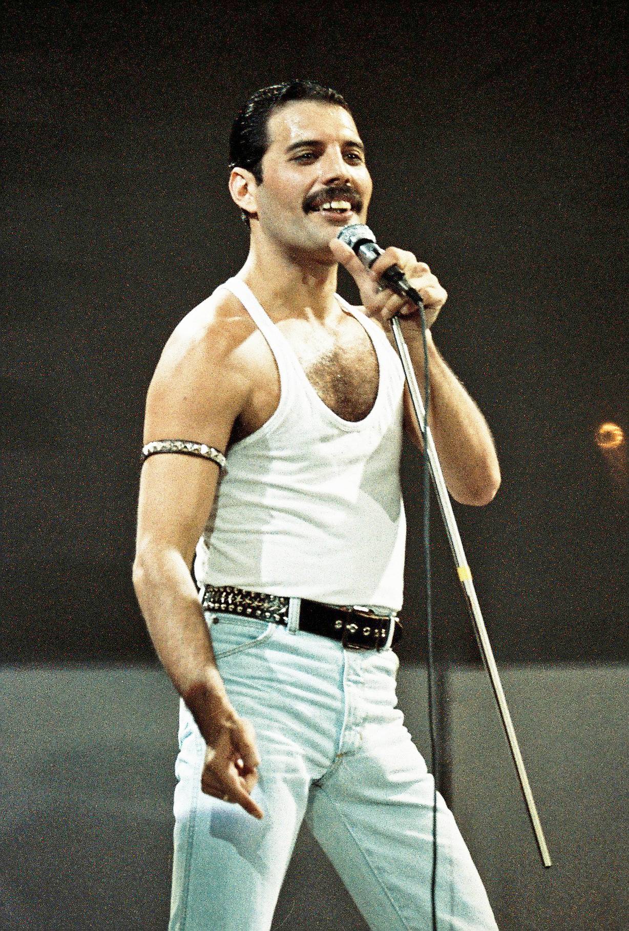 Freddie Mercury of Queen performs on stage at Live Aid on 13 July 1985 in Wembley Stadium, London, England. | Source: Getty Images