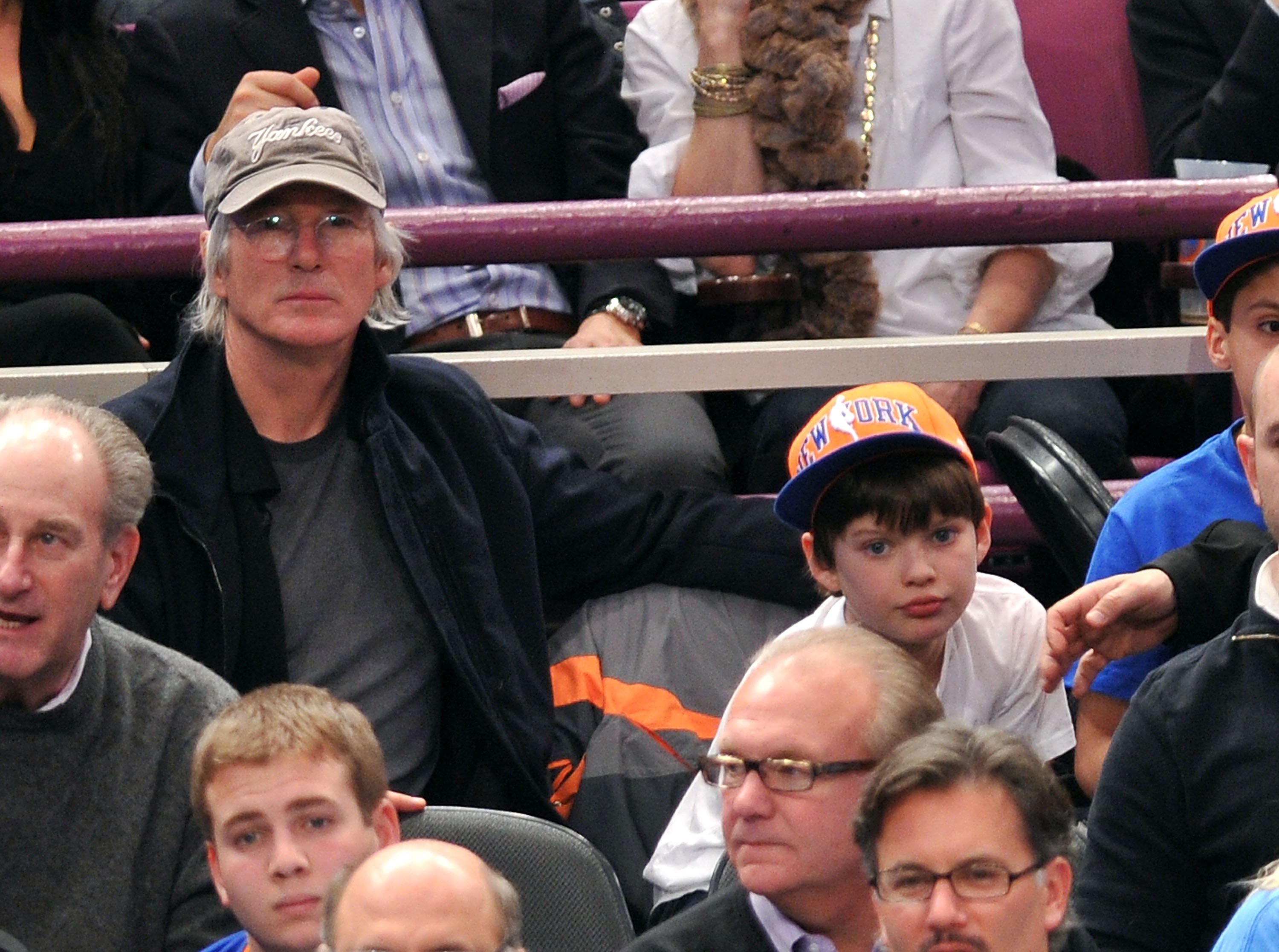 Richard Gere and Homer James Jigme Gere at the Utah Jazz vs. New York Knicks game on March 7, 2011 | Source: Getty Images