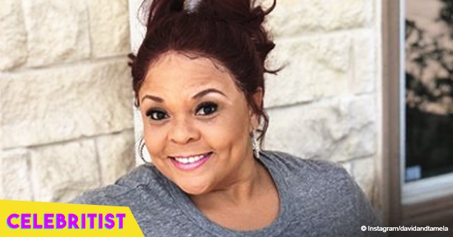 Tamela Mann turns 52 and stuns in red, sleeveless top & distressed jeans in latest birthday pic