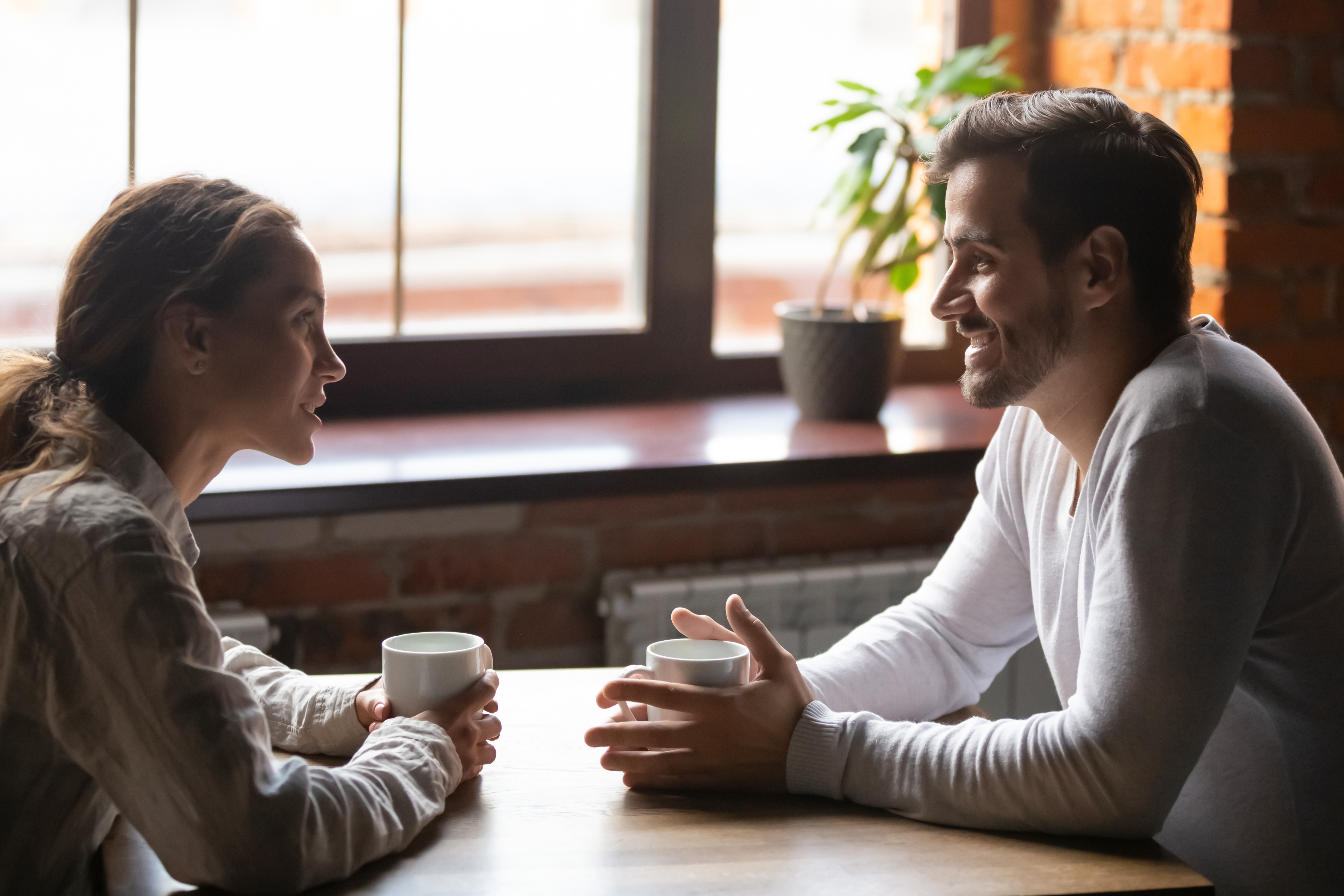 Man and woman have conversation | Source: Shutterstock