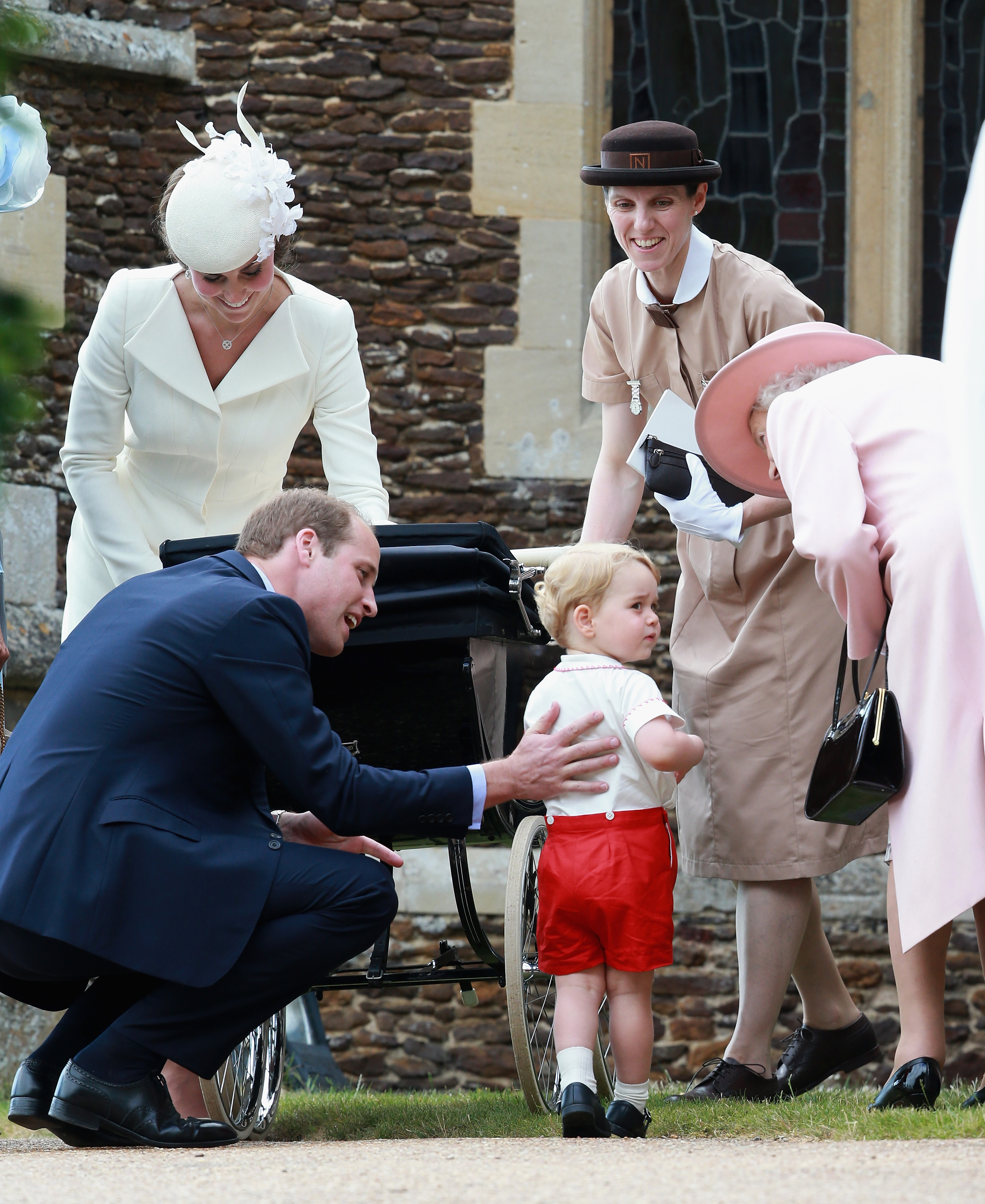 Princess Catherine, Prince William, Prince George, Princess Charlotte, Queen Elizabeth II and Maria Borrallo at Church of St Mary Magdalene on the Sandringham Estate for the Christening of Princess Charlotte of Cambridge on July 5, 2015 in King's Lynn, England | Source: Getty Images