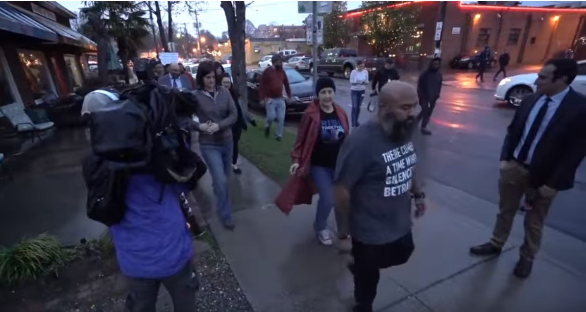 Andrew Woods and dozens of other protesters | Photo: YouTube/The Charlotte Observer