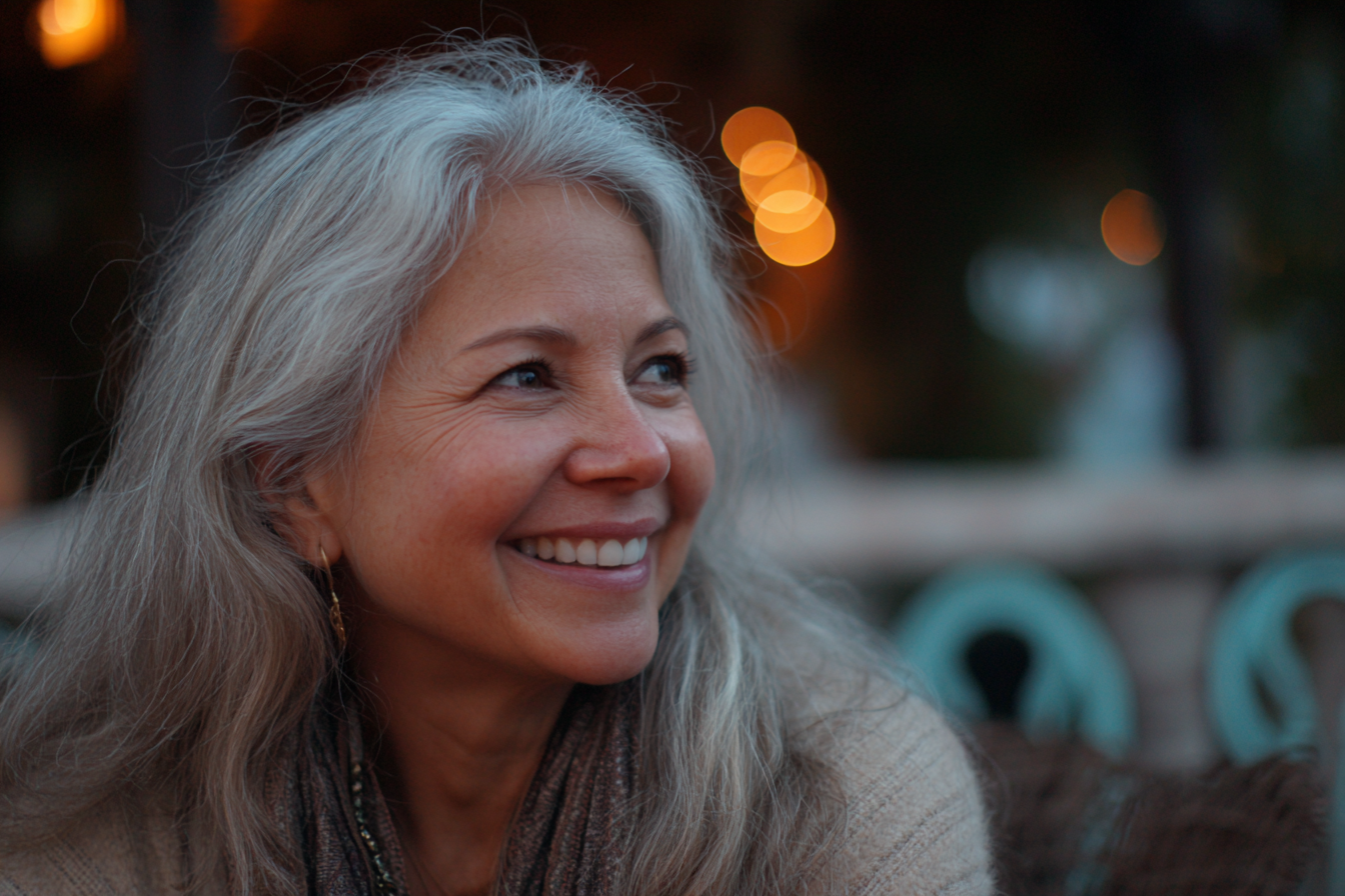 An older woman smiling | Source: Midjourney