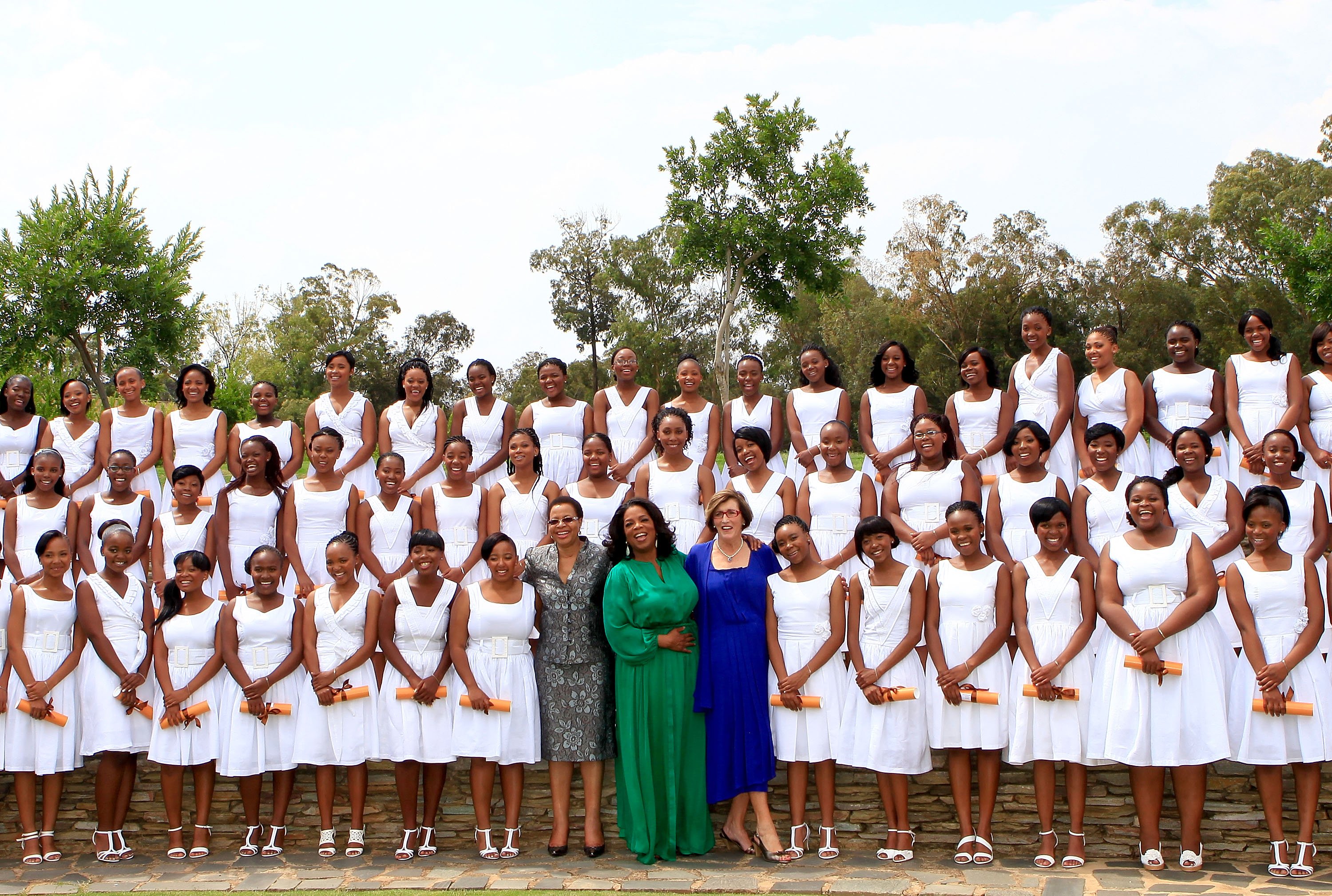 Oprah Winfrey poses with the Graduates on her arrival at the inaugural graduation of the class of 2011 at Oprah Winfrey Leadership Academy for Girls on January 14, 2012 in Henley on Klip, South Africa | Source: Getty Images