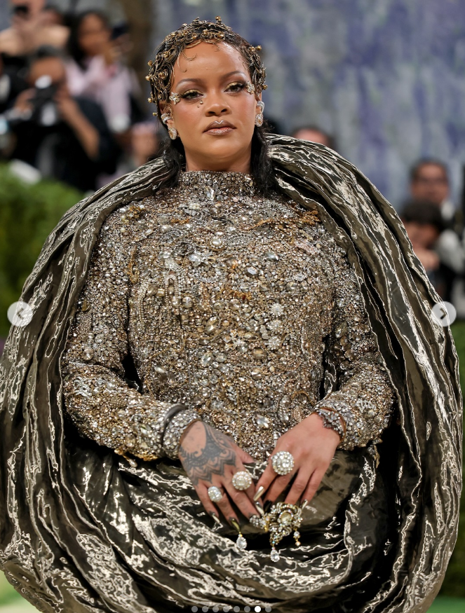 Rihanna attends the 2026 Met Gala celebrating "Costume Art" in New York City, wearing a heavily embellished, sculptural ensemble with metallic draping. | Source: Instagram/entertainmenttonight