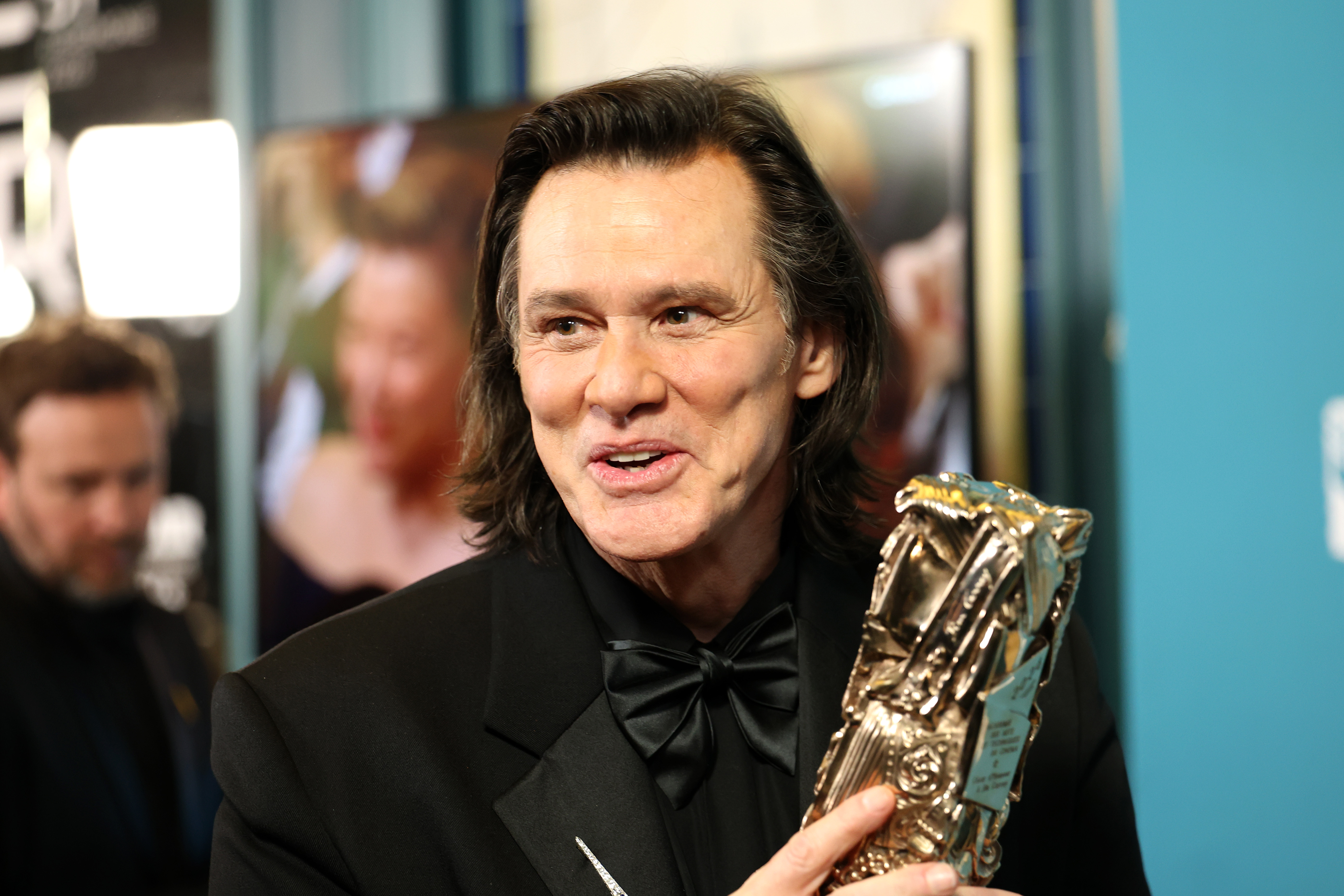 Jim Carrey poses with the Honorary Cesar Award during the 51st Cesar Film Awards at L'Olympia on February 26, 2026 in Paris, France | Source: Getty Images