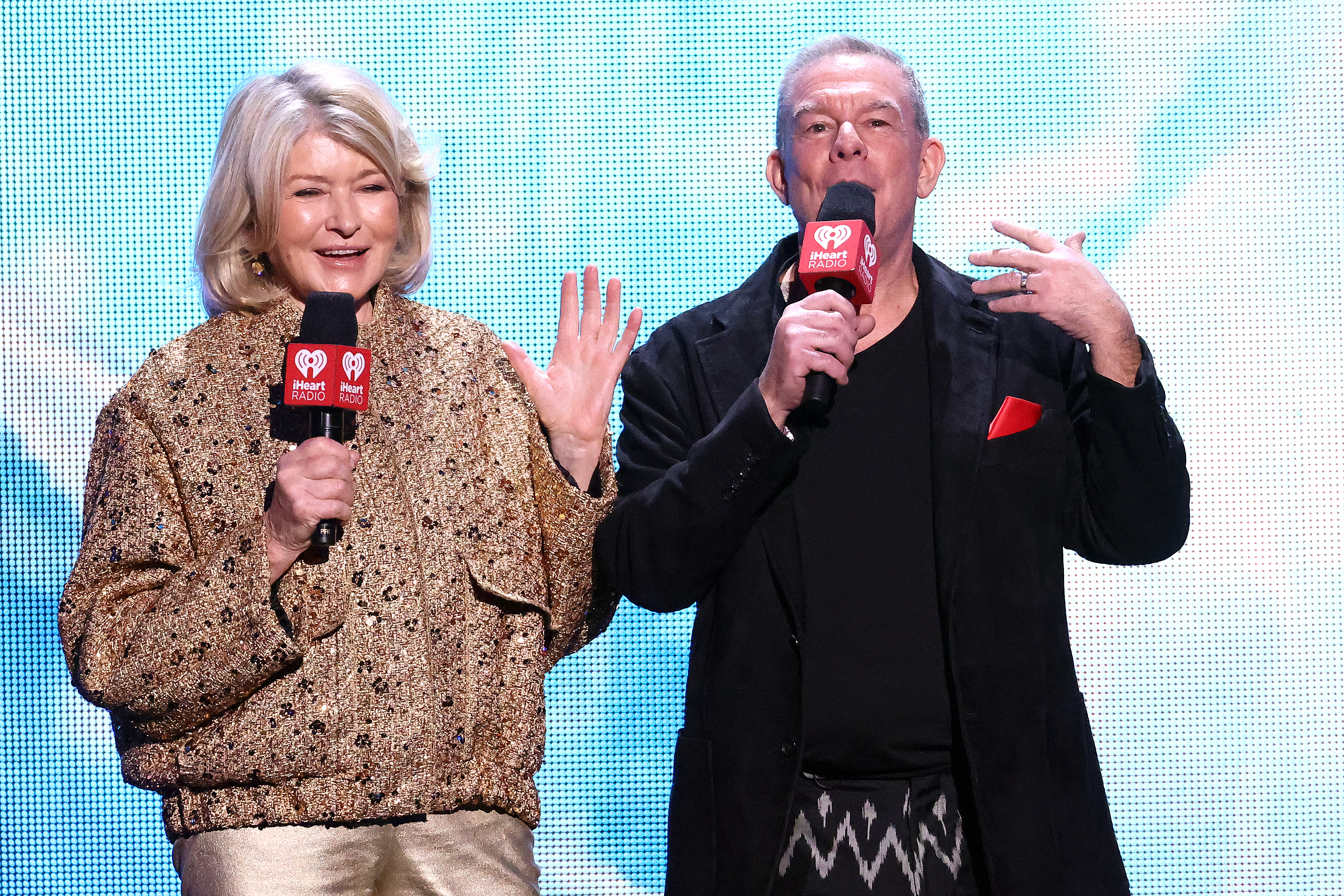Martha Stewart and Elvis Duran grace the stage during iHeartRadio z100's Jingle Ball 2023 on December 08, 2023, in New York City | Source: Getty Images