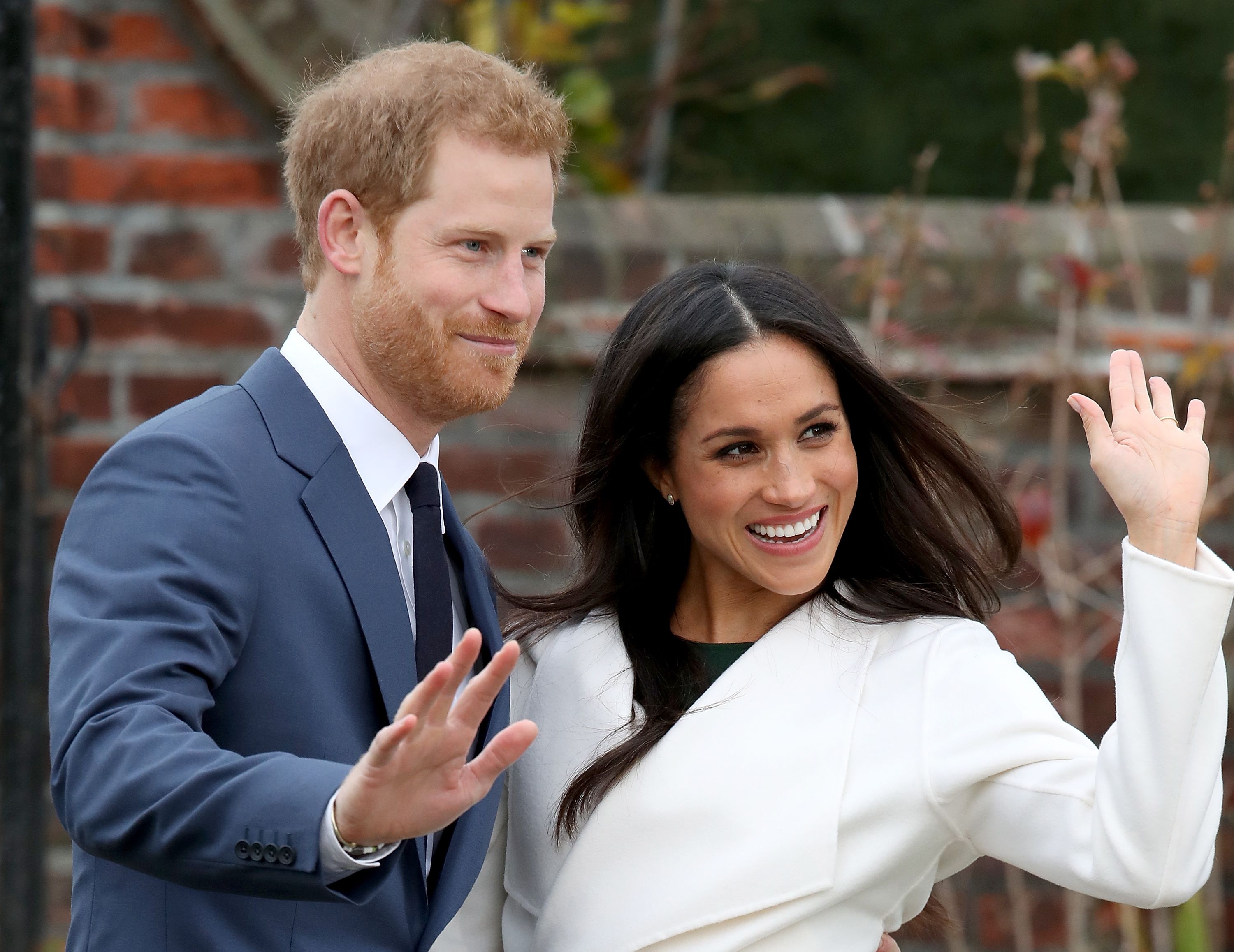 Prince Harry and Meghan Markle during an official photocall to announce their engagement at The Sunken Gardens at Kensington Palace on November 27, 2017 in London, England. | Source: Getty Images