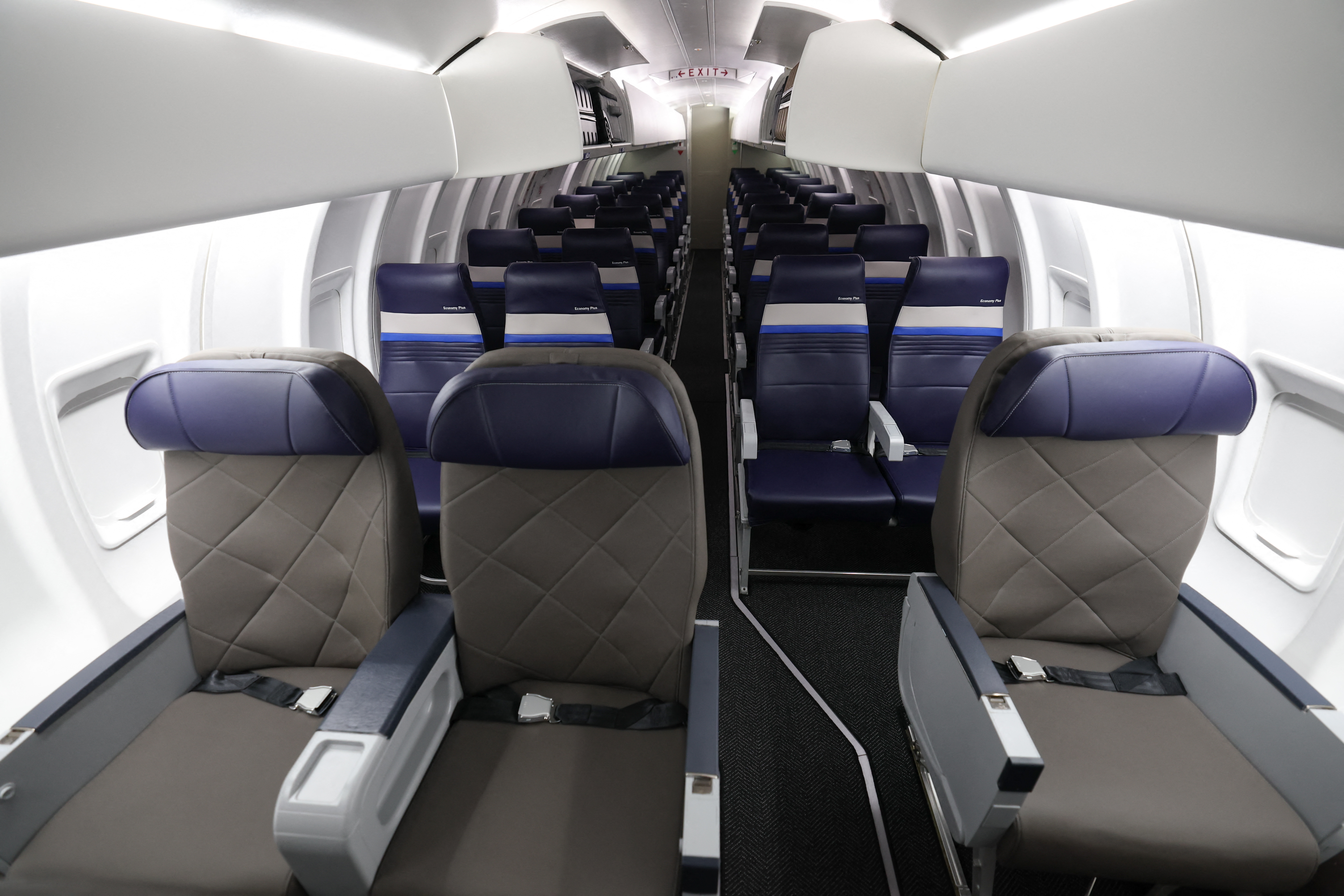 First class and Economy Plus seating inside a United Airlines Express CRJ-450 is displayed during a media event showcasing the airline's new premium "Elevated" aircraft interior at Los Angeles International Airport on March 24, 2026 | Source: Getty Images