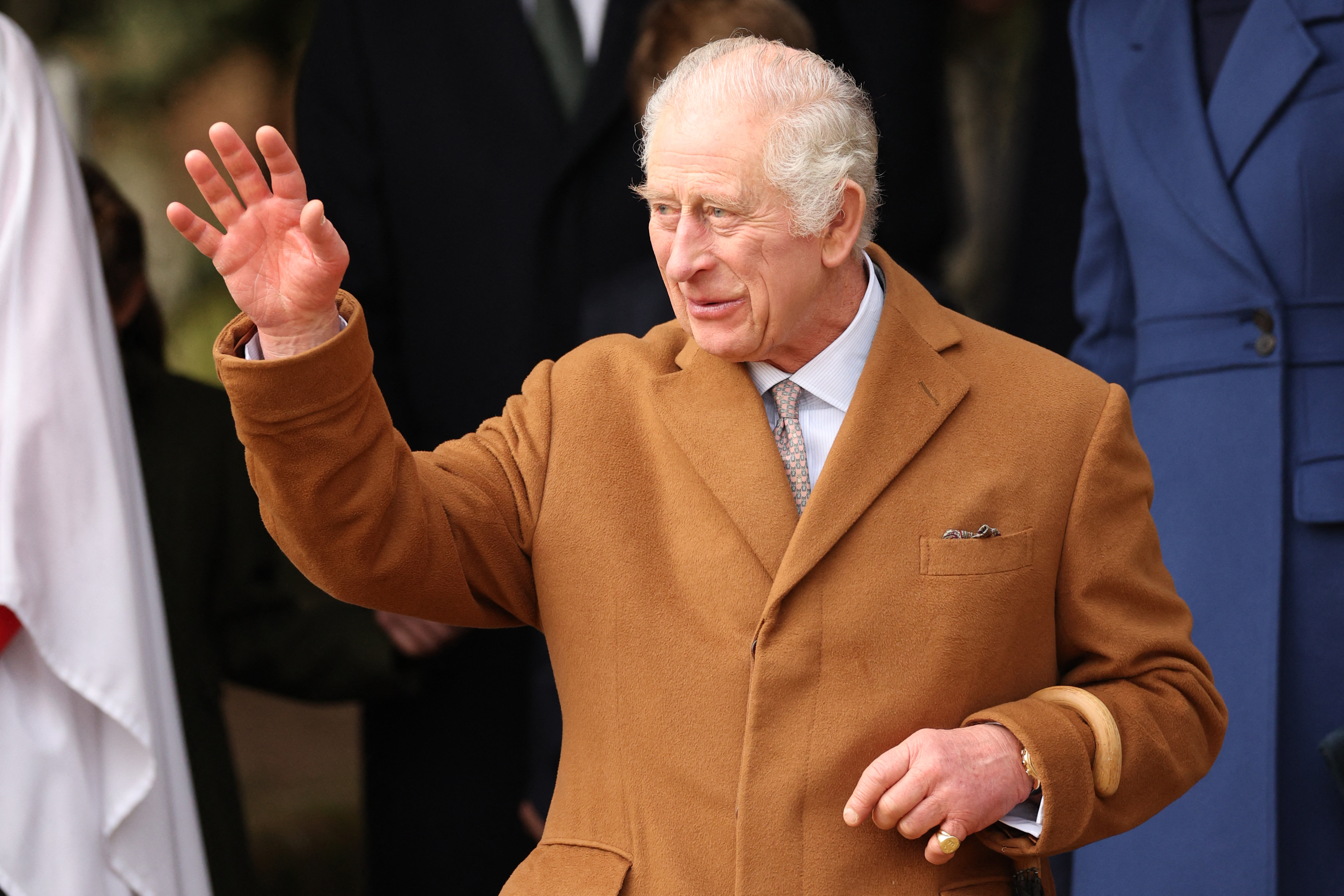 King Charles III waving to well-wishers after attending the Royal Family's traditional Christmas Day service at St Mary Magdalene Church on the Sandringham Estate in eastern England, on December 25, 2023 | Source: Getty Images