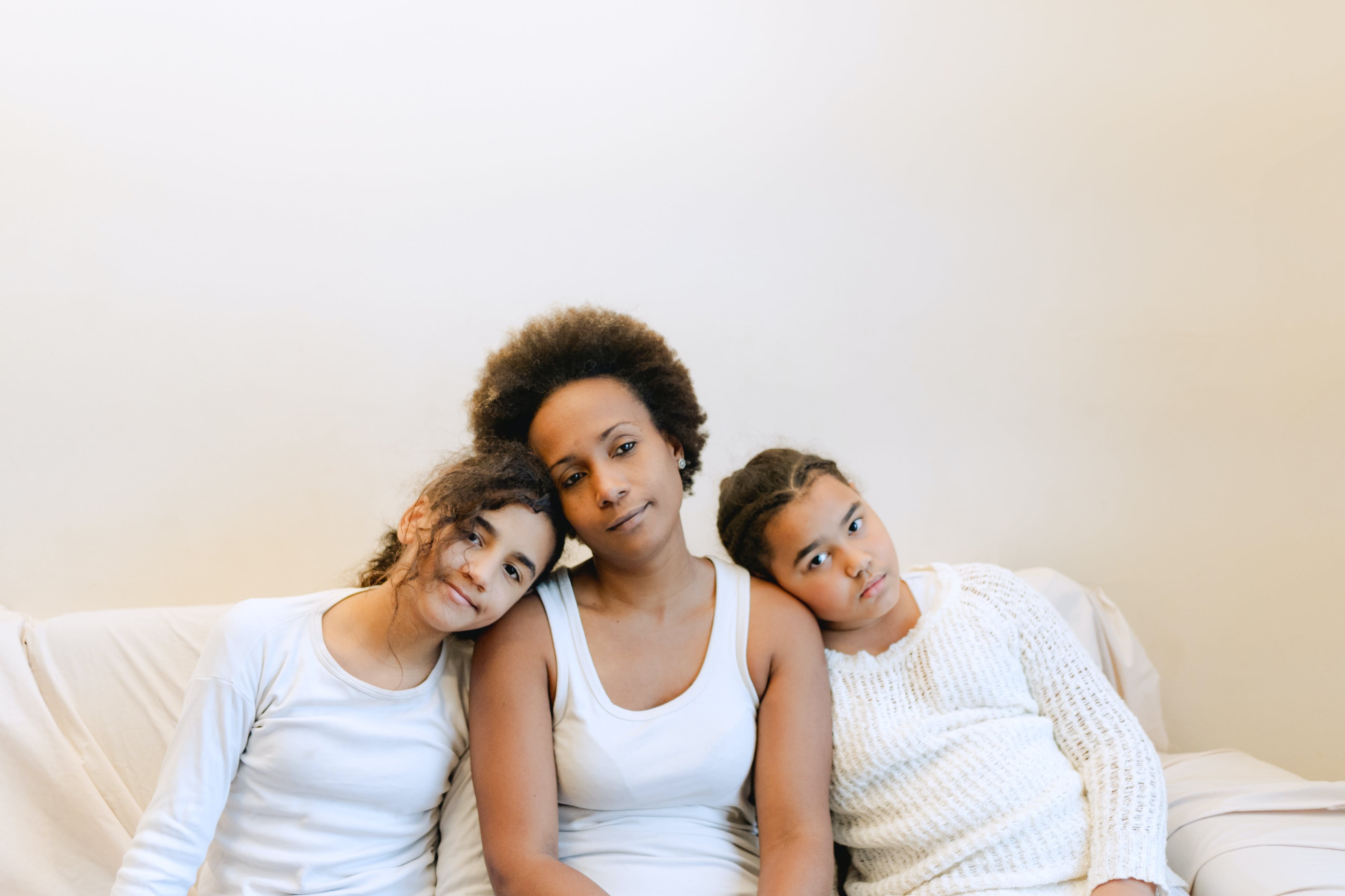 Mother bonding with her daughters. | Source: Pexels
