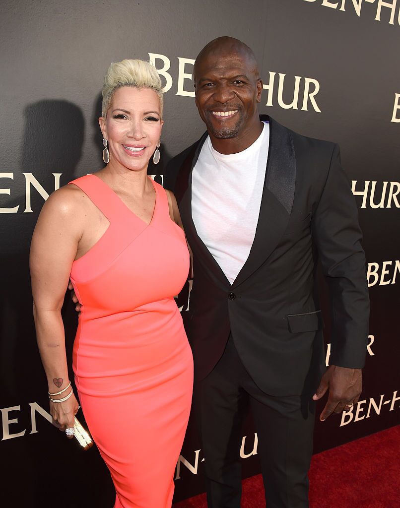 Terry Crews (R) and his wife Rebecca King-Crews arrive at the premiere of Paramount Pictures' "Ben-Hur" at the Chinese Theatre. | Source: Getty Images