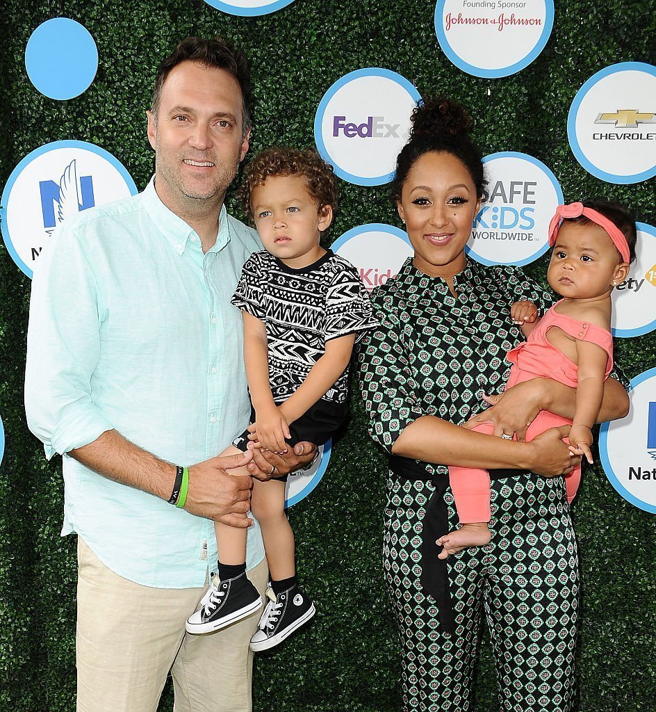 Adam Housley, Aden John Tanner Housley, Tamera Mowry and Ariah Talea Housley attend Safe Kids Day at Smashbox Studios in Culver City, California | Photo: Getty Images