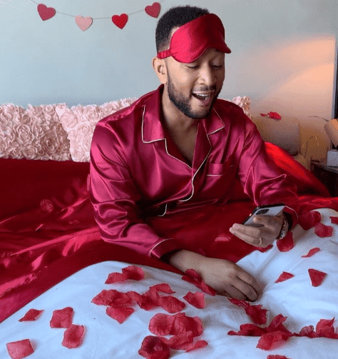 John Legend wakes up to a call from "Cupid" on February 1, 2020, in humorous spoofed video. | Source: Instagram/johnlegend.