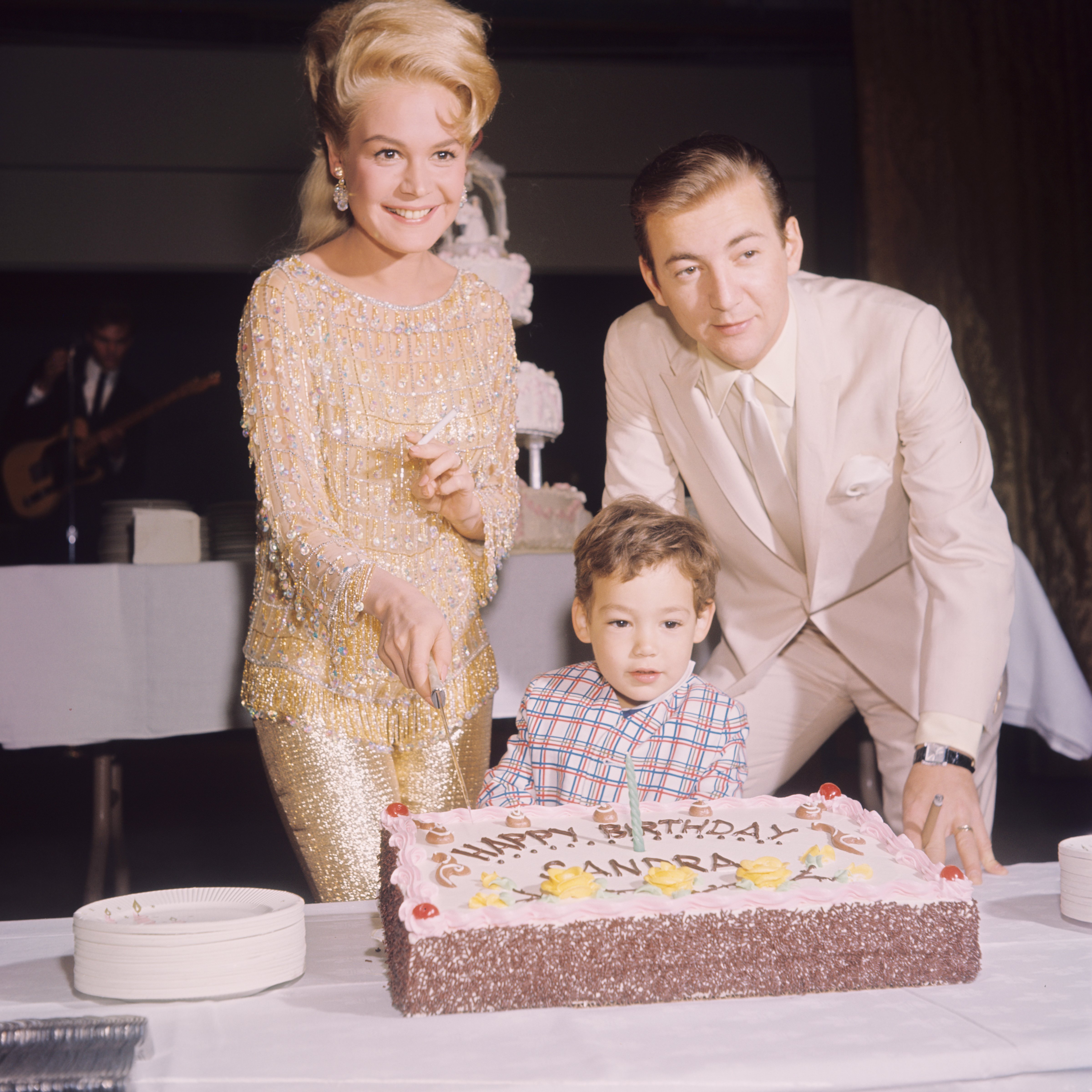 Bobby Darin celebrates his wife, Sandra Dee's birthday with a cake alongside their son Dodd Darin, circa 1966 | Source: Getty Images