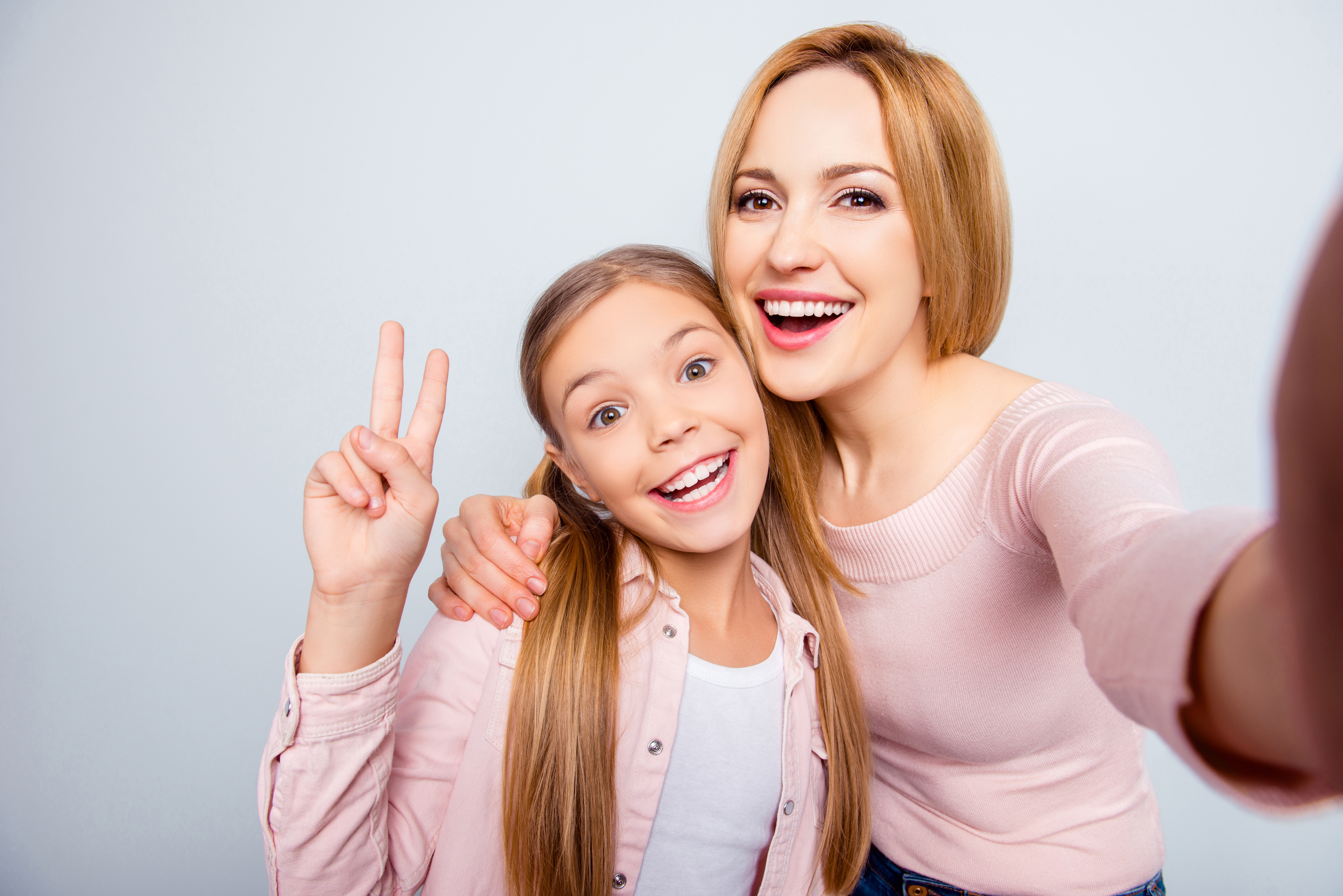 Happy girl and mom | Shutterstock
