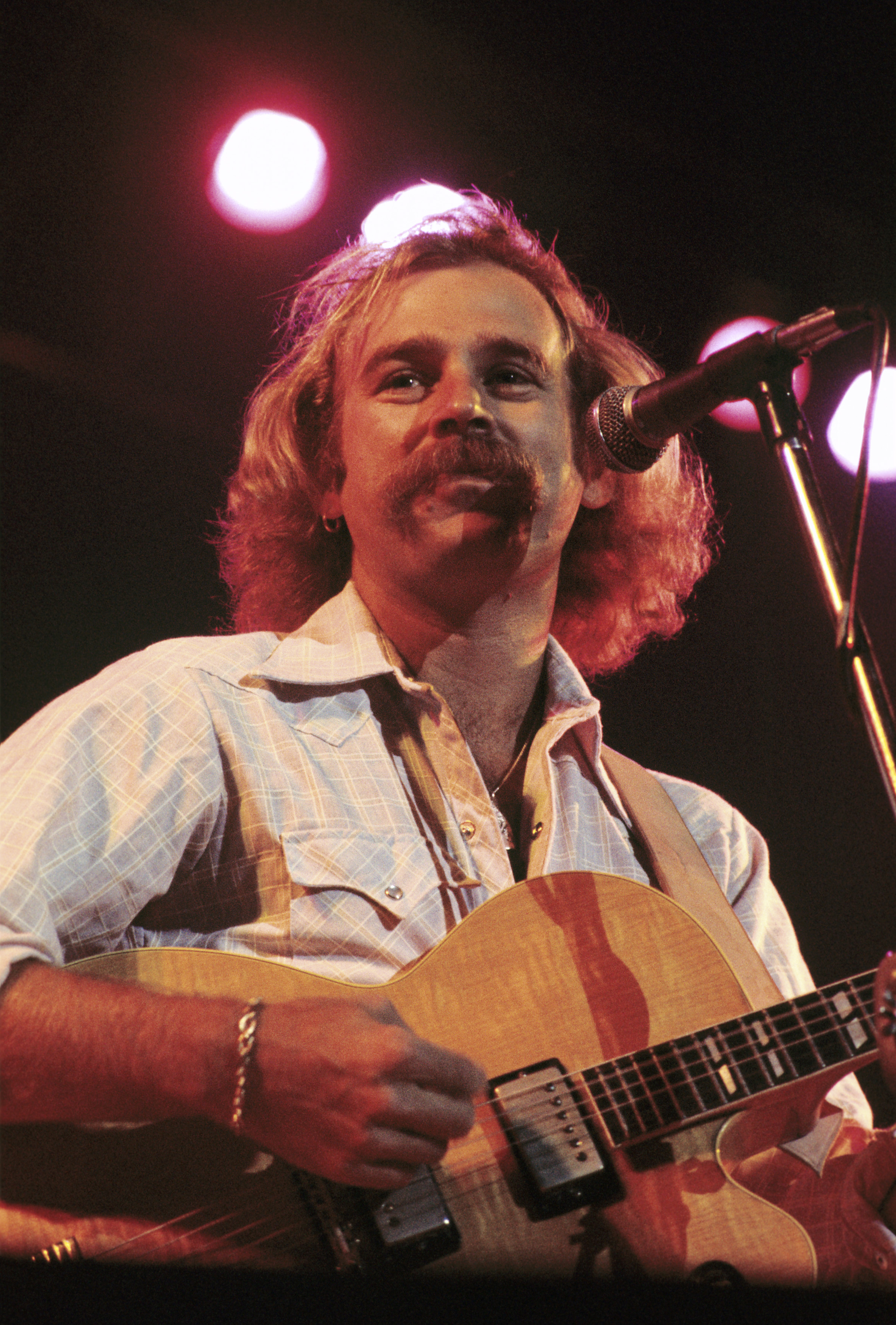Jimmy Buffett performs with The Coral Reefer Band at The Omni Coliseum on September 4, 1976, in Atlanta, Georgia. | Source: Getty Images