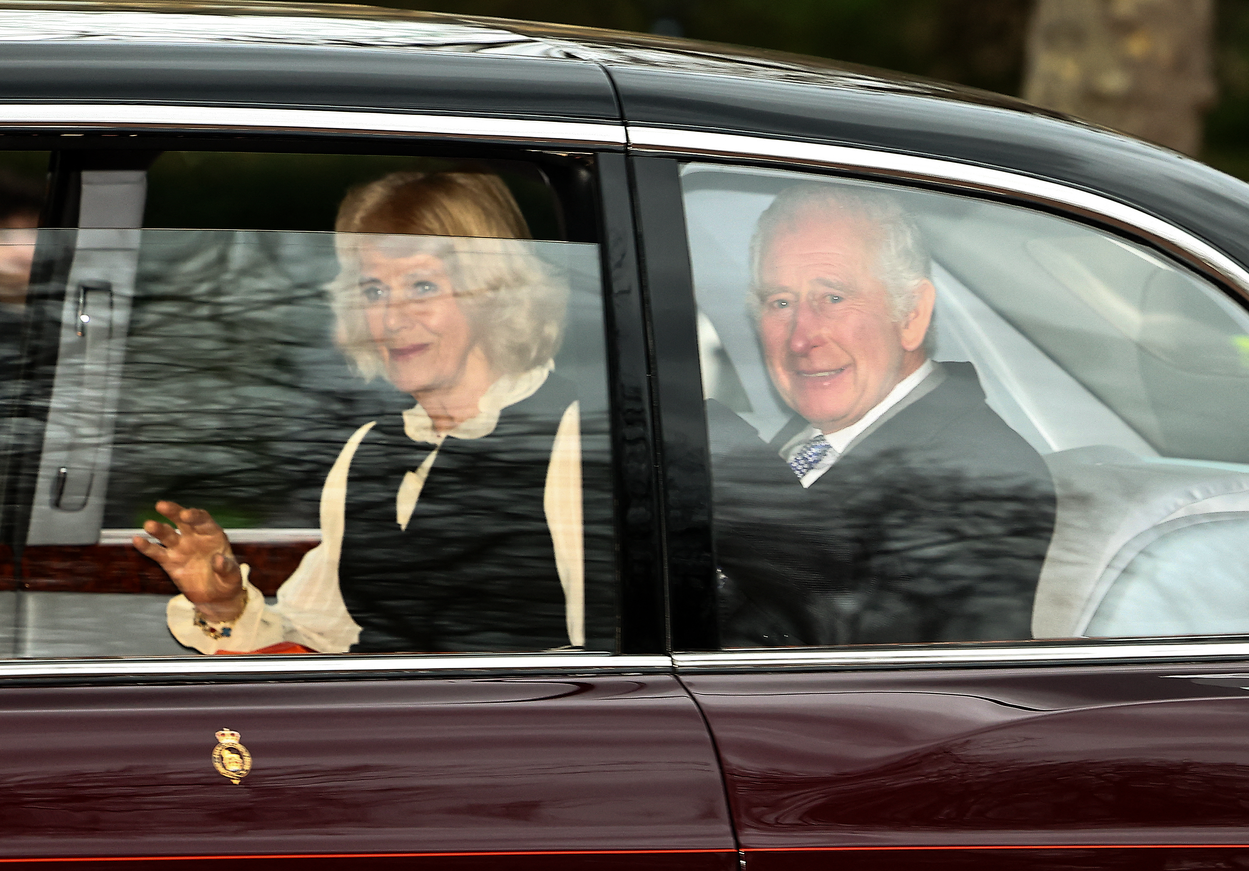King Charles III and Queen Camilla wave as they leave Clarence House in London on February 6, 2024 | Source: Getty Images