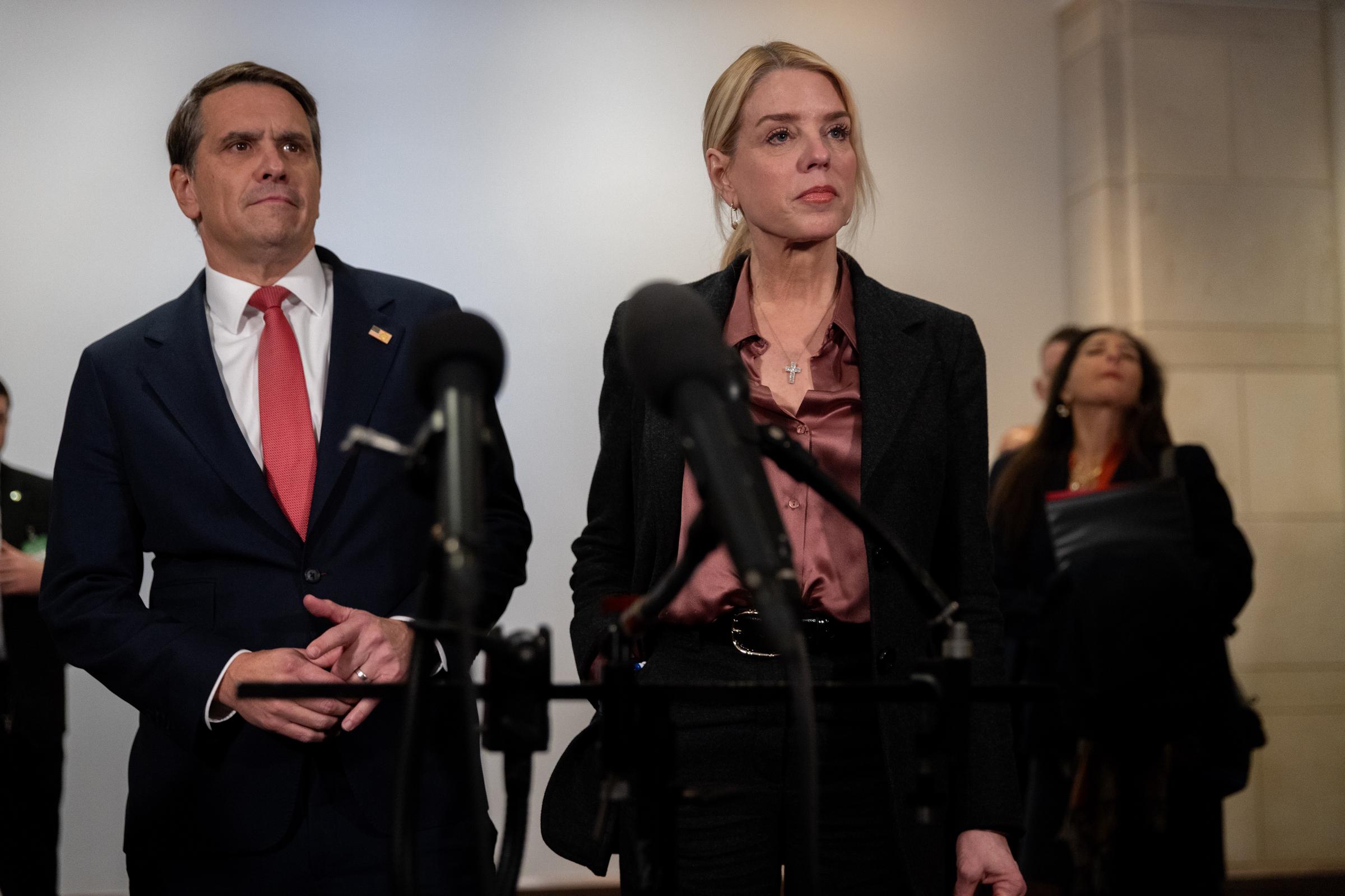 Pam Bondi and Todd Blanche speak to reporters following a closed briefing in front of the House Oversight Committee at the U.S. Capitol on March 18, 2026, in Washington, DC | Source: Getty Images