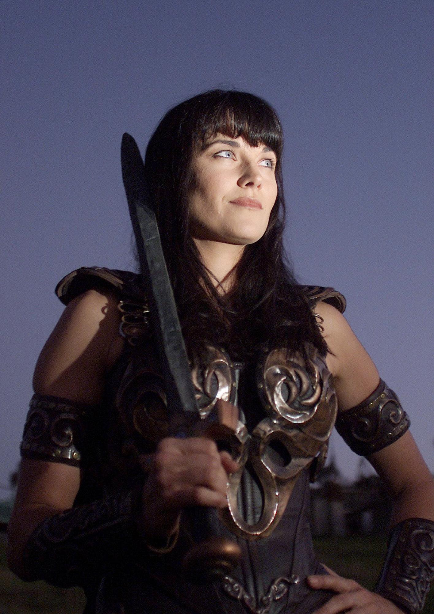 Lucy Lawless as Xena during the final night of filming for the last episode of "Xena: Warrior Princess" on March 30, 2001 | Source: Getty Images