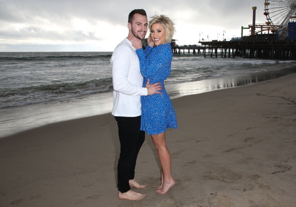 Savannah Chrisley and fiance Nic Kerdiles on the beach as they celebrate their Engagement | Photo: Getty Images