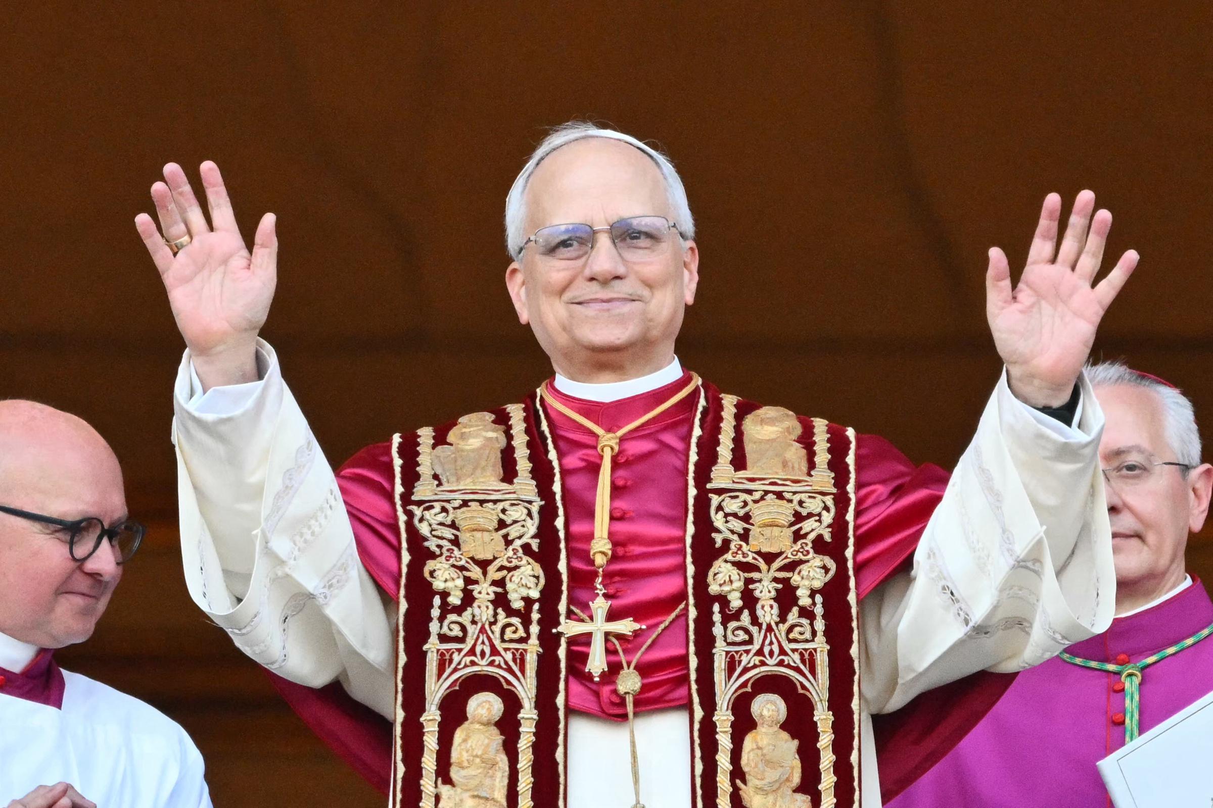 Pope Leo XIV, Robert Prevost arrives on the main central loggia balcony of the St Peter's Basilica for the first time on May 8, 2025 | Source: Getty Images