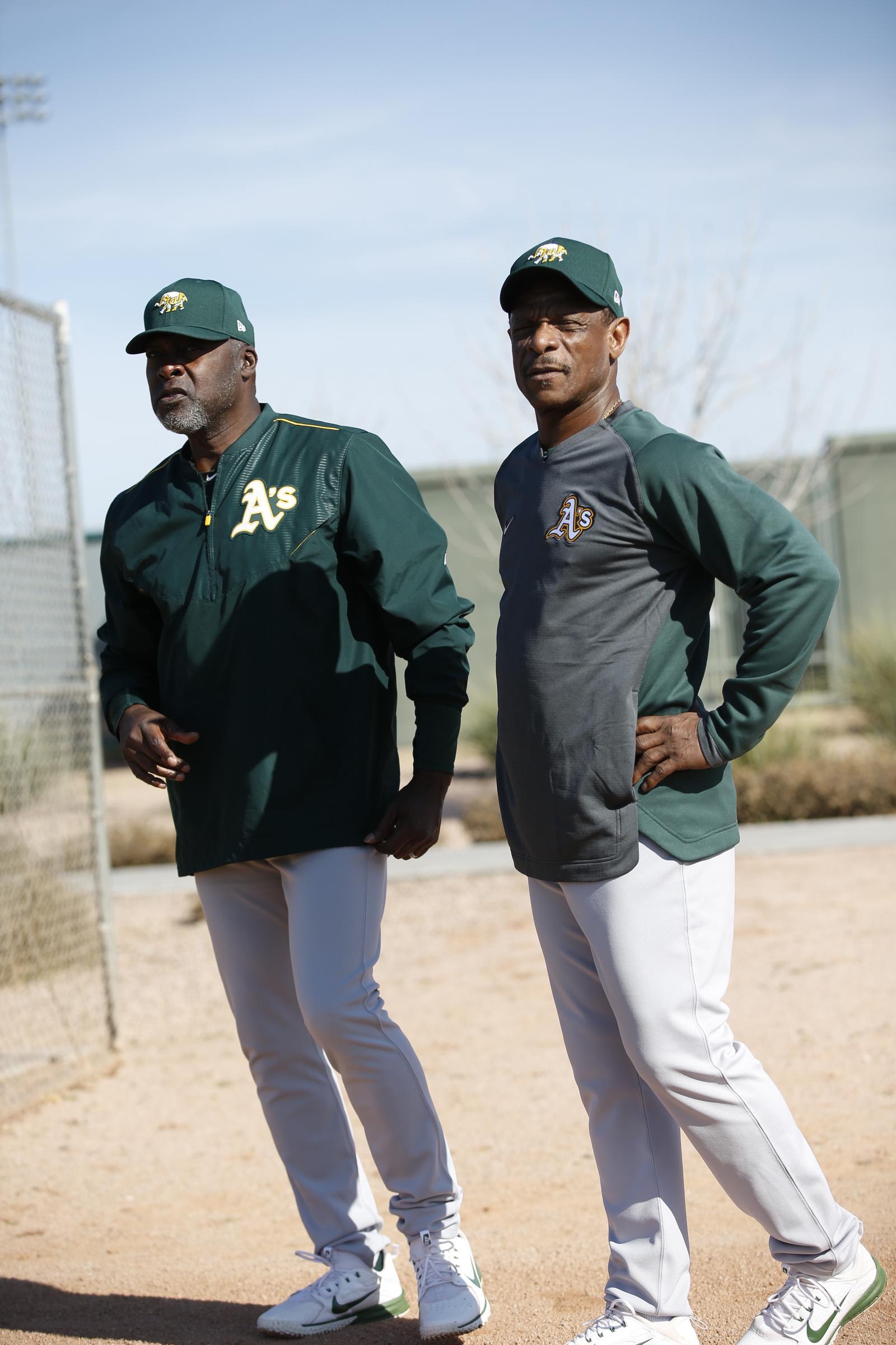 Dave Stewart and Rickey Henderson talk on the field during a workout at Fitch Park in Mesa, Arizona, on February 18, 2020 | Source: Getty Images