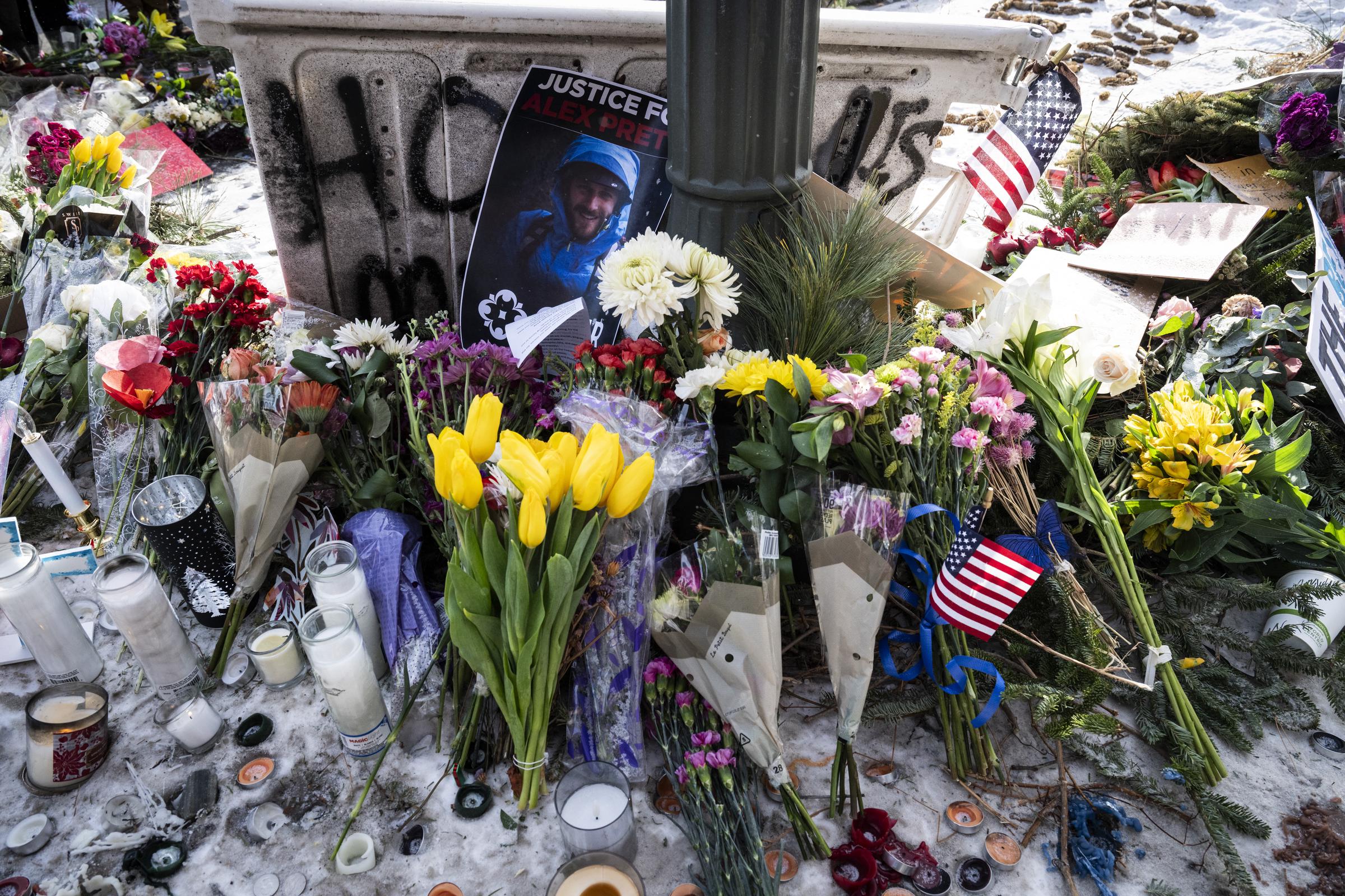 Flowers are left at a makeshift memorial in the area where Alex Pretti was shot dead a day earlier by federal immigration agents in Minneapolis, Minnesota, on January 25, 2026. | Source: Getty Images