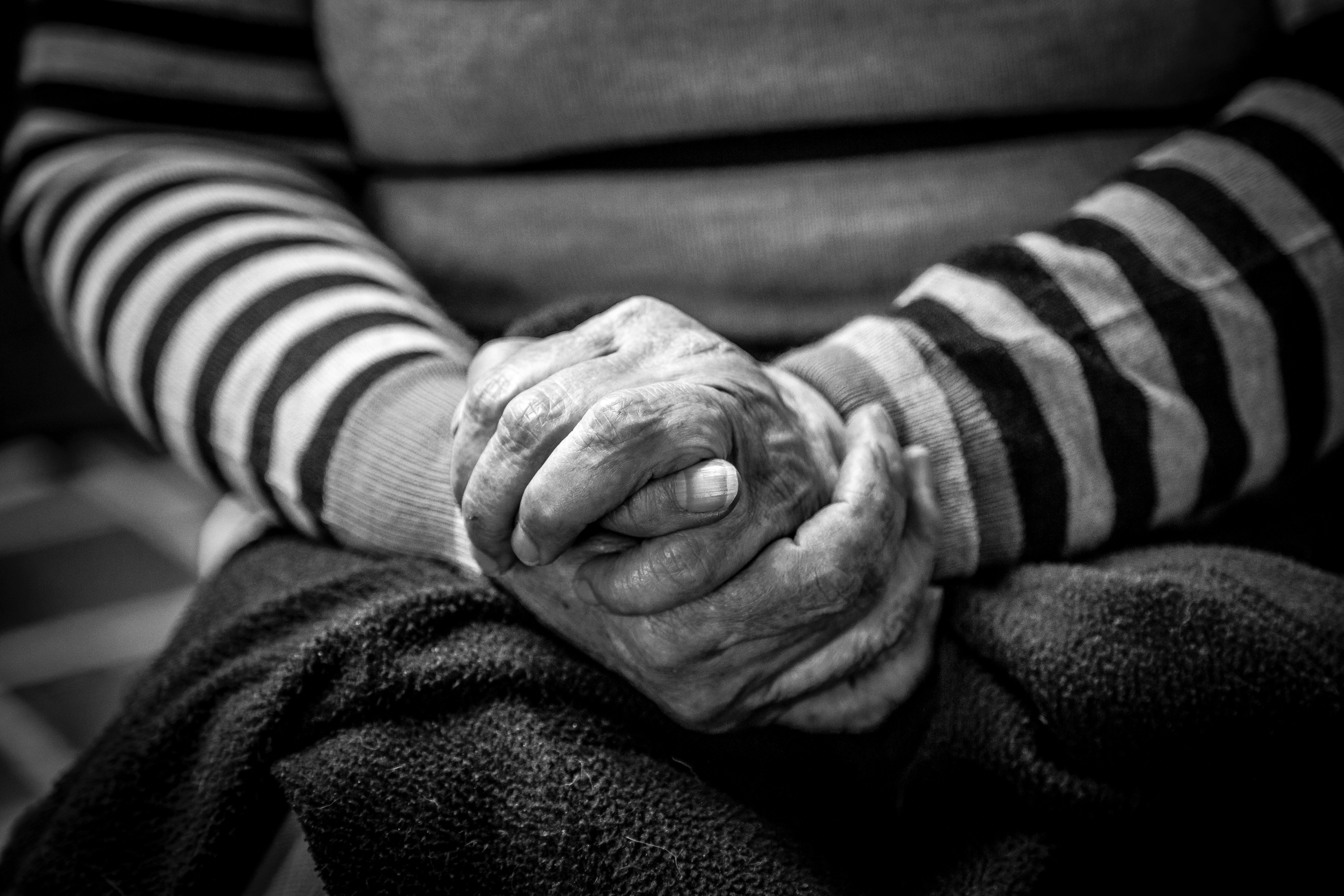 An old lady clasping her hands | Photo by Jorge Lopez on Unsplash