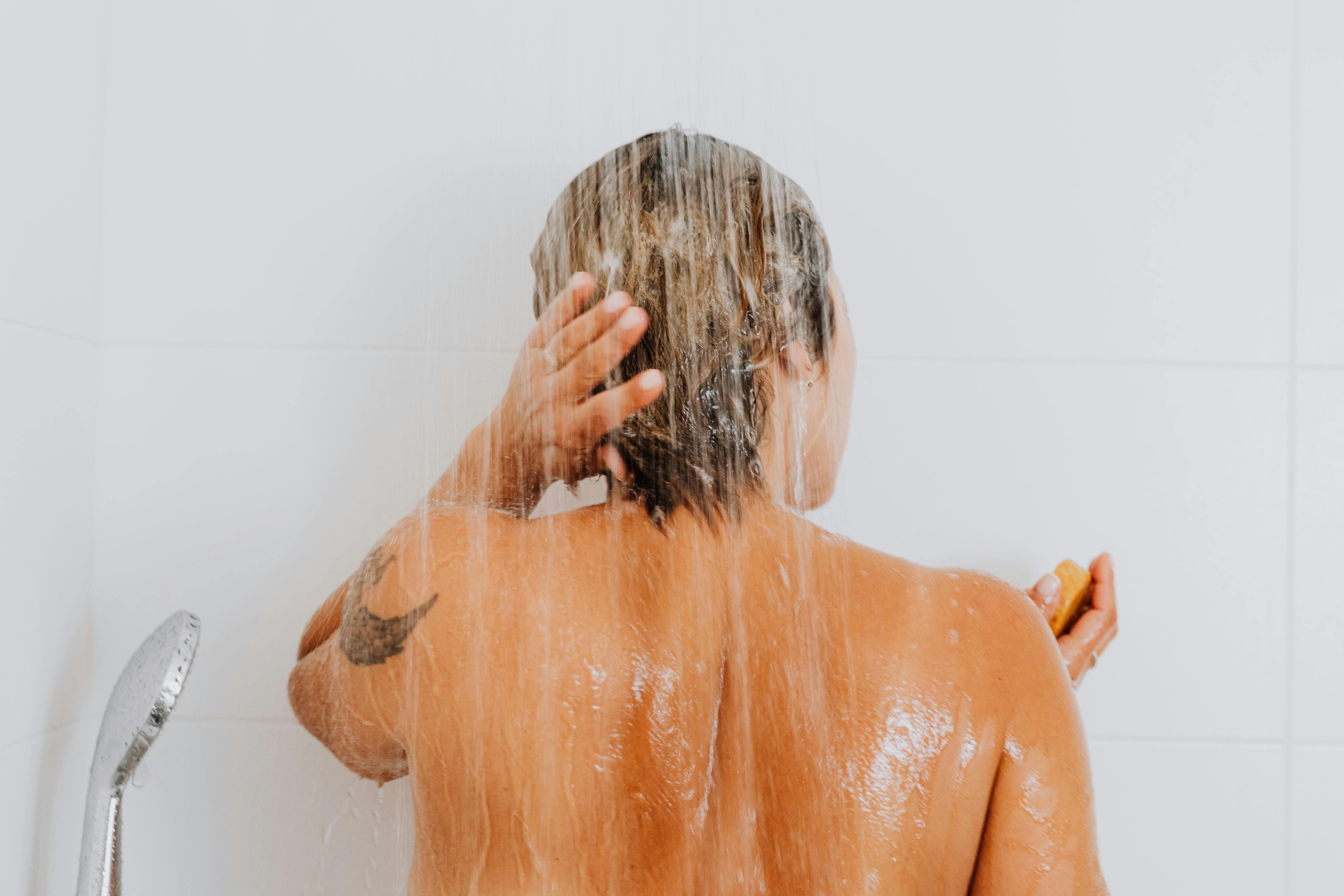 A woman taking a shower | Source: Pexels