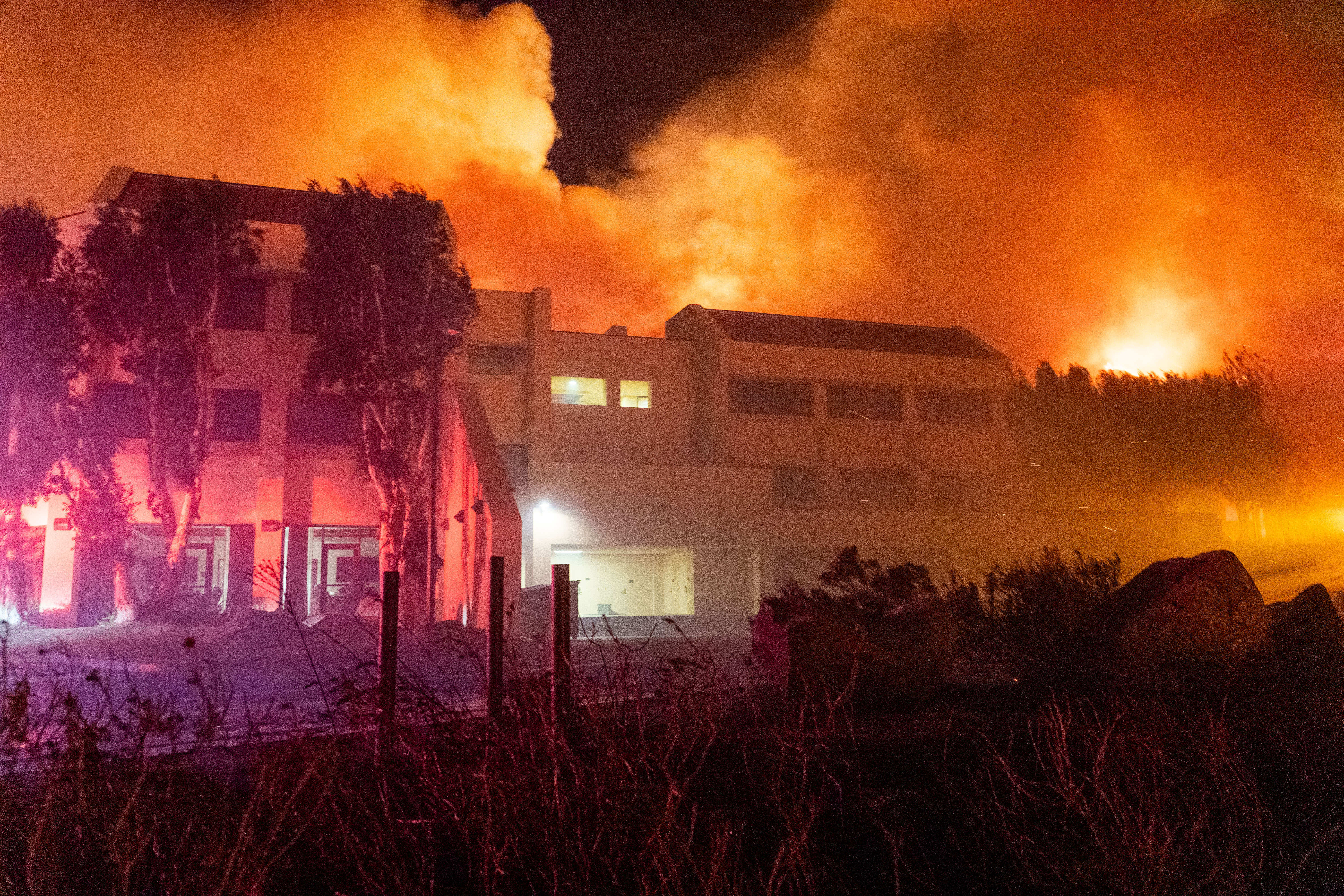 Firefighters work to contain the fast-moving Franklin fire as hillsides burn near Pepperdine University in Malibu, California, on December 10, 2024 | Source: Getty Images