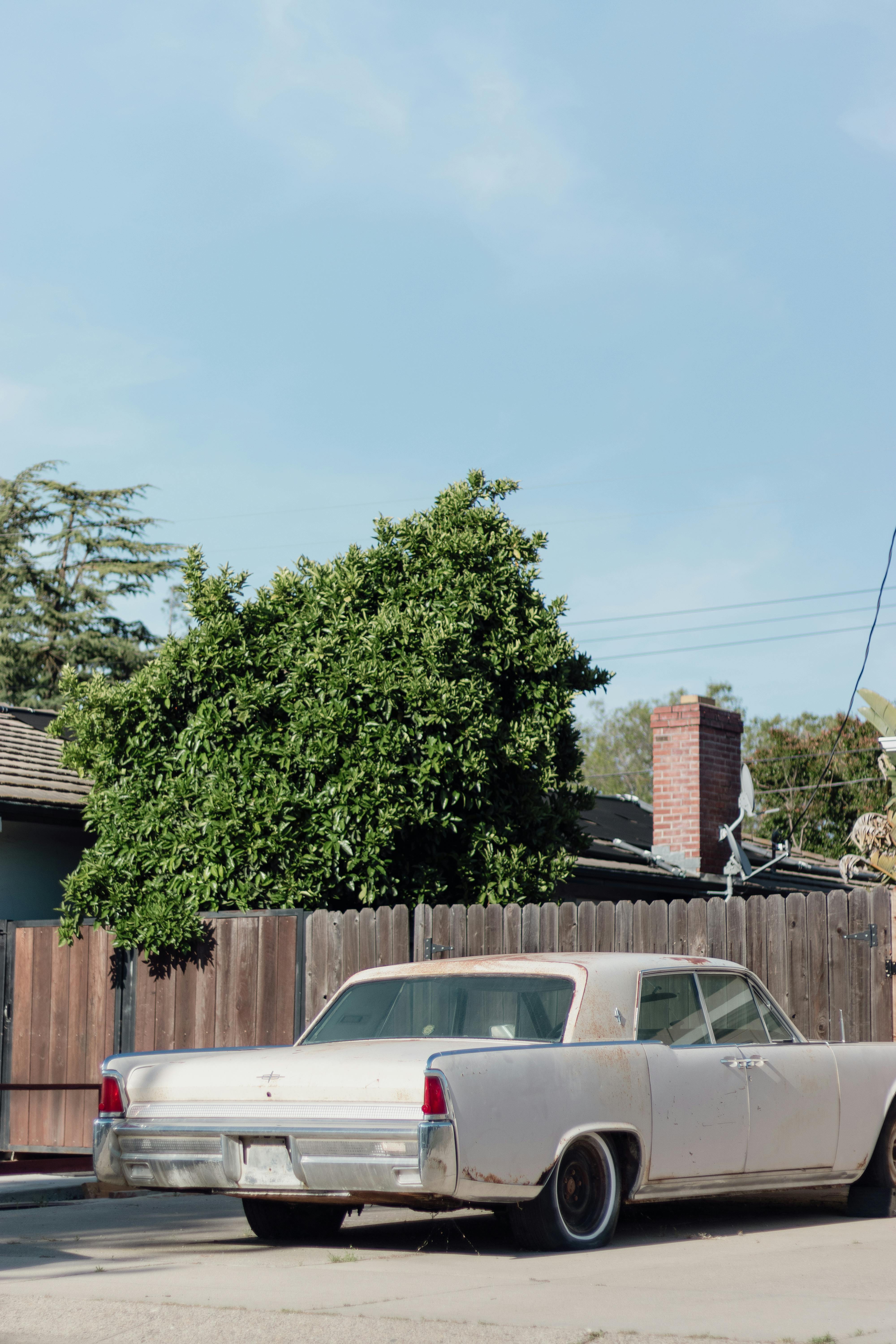 A wooden fence separating two houses | Source: Pexels