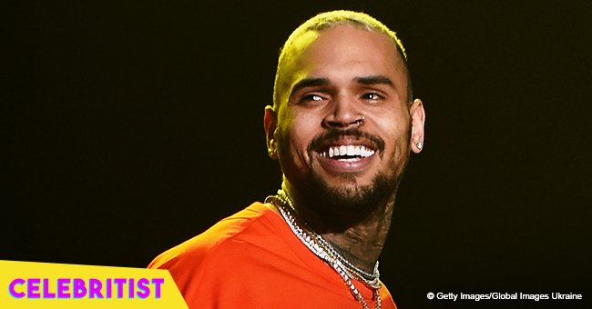 Chris Brown helps a boy who fainted while on stage with him at N.J. show