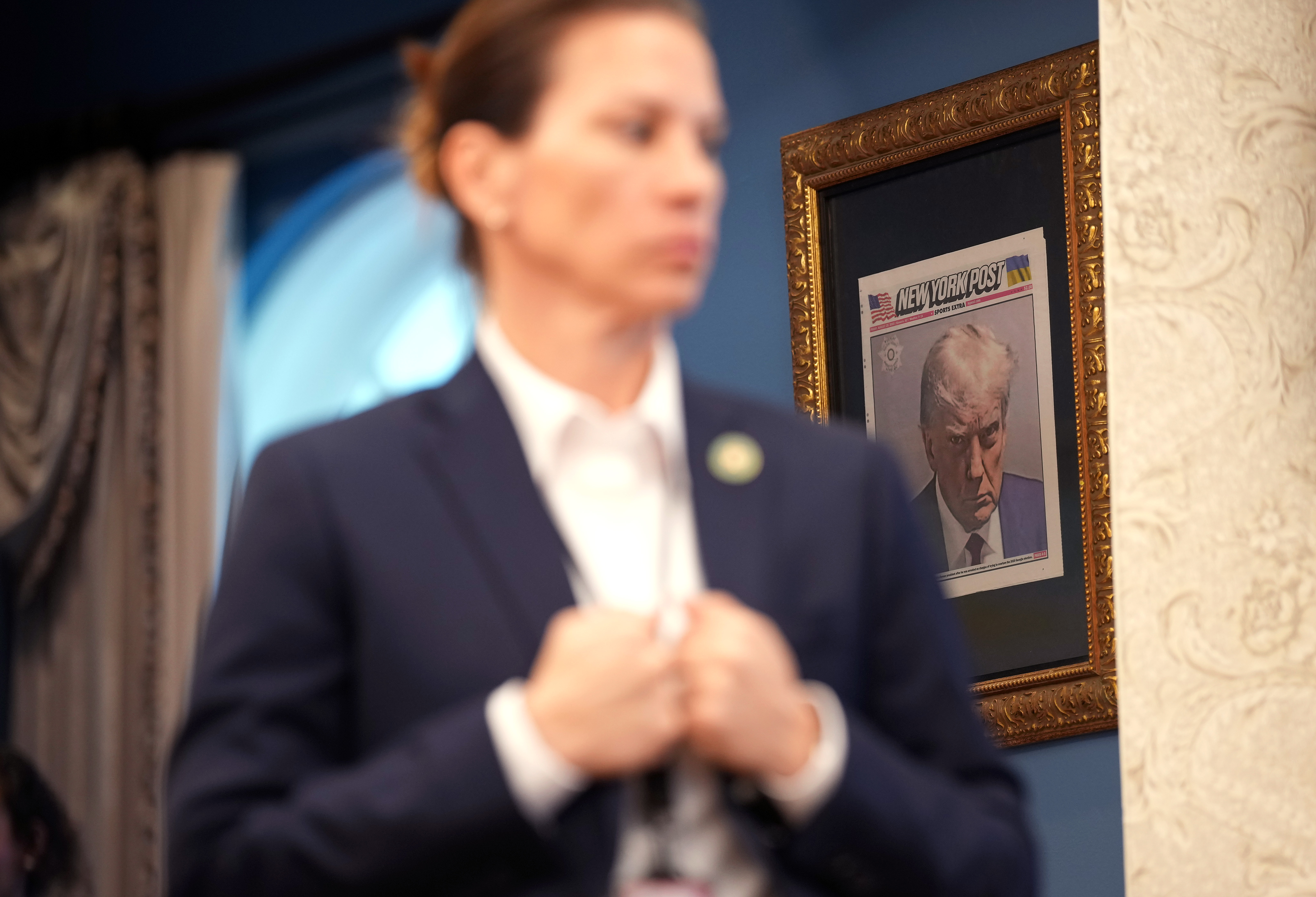 A framed copy of President Donald Trump's New York Post mugshot in the Oval Office | Source: Getty Images