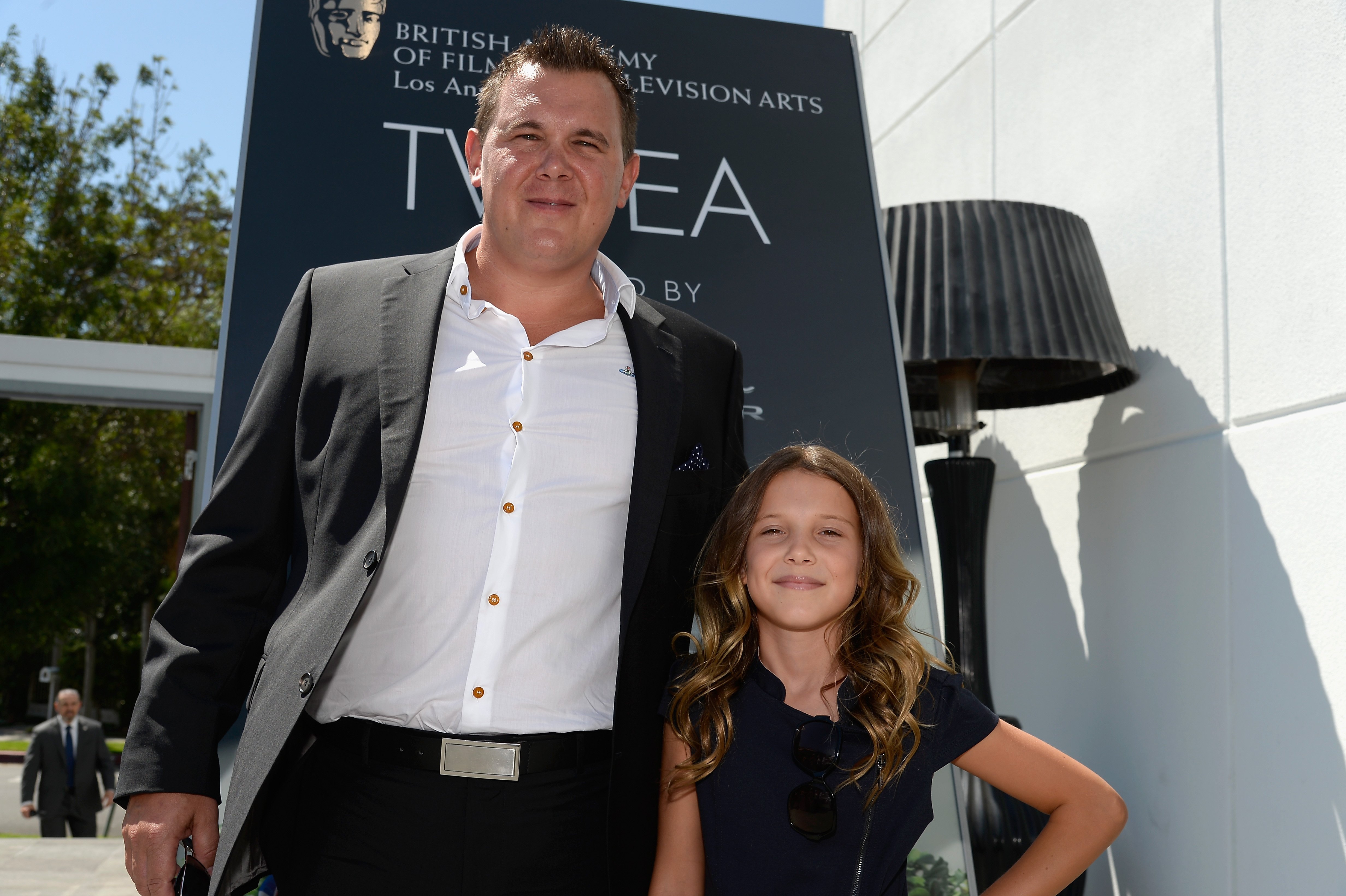 Robert Brown (L) and actress Millie Brown attend the 2014 BAFTA Los Angeles TV Tea at SLS Hotel, on August 23, 2014, in Beverly Hills, California. | Source: Getty Images