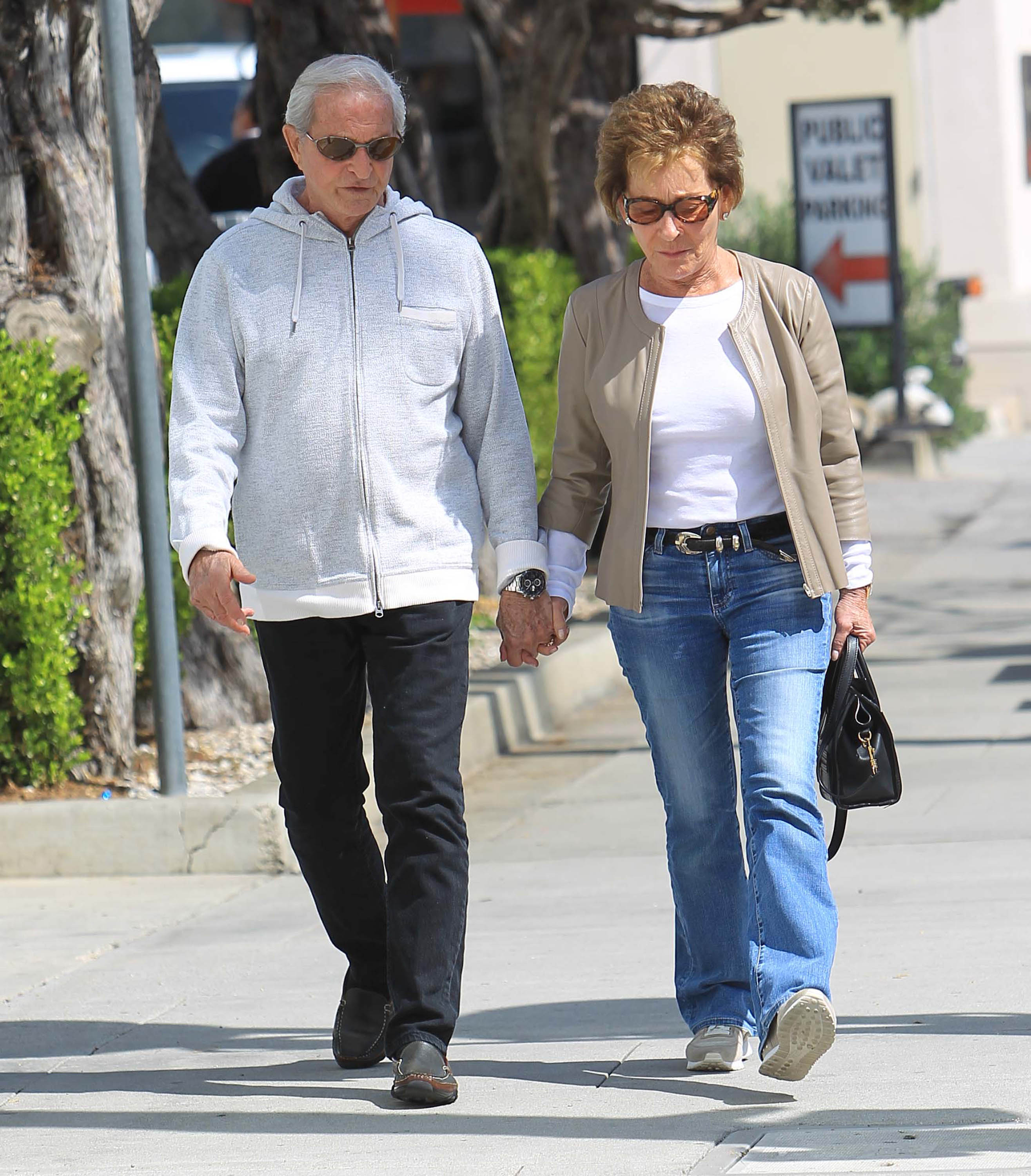 Judge Judy and her husband Jerry Sheindlin walking in Los Angeles in 2018 | Source: Getty Images