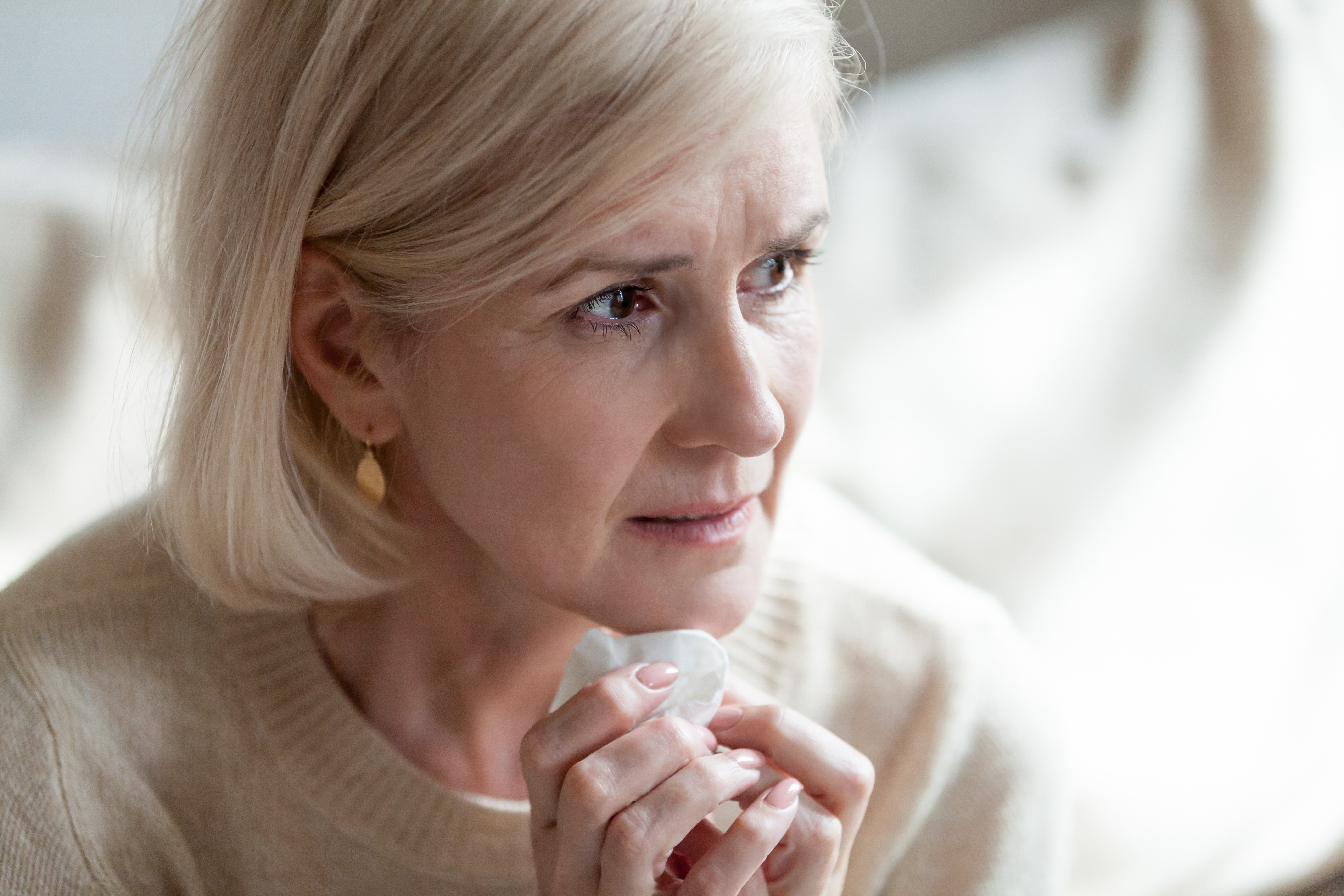 A sad senior woman in tears | Source: Shutterstock