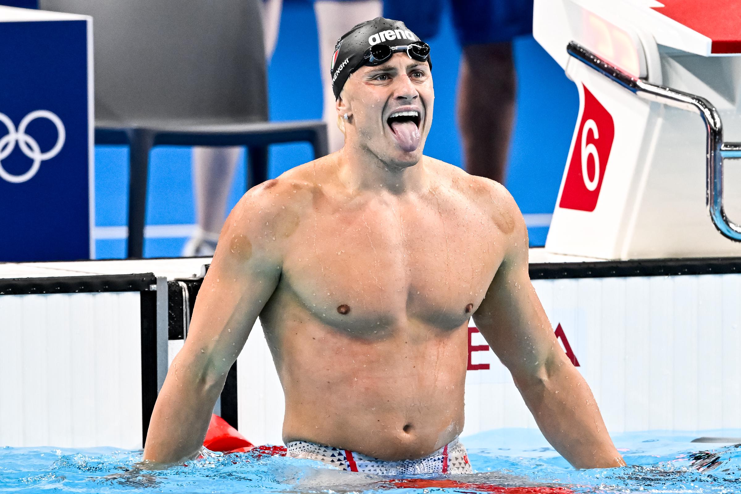 Nicolo Martinenghi of Italy celebrates with his tongue out after winning gold in the Mens 100m Breaststroke Final at the Paris 2024 Olympic Games on July 28, 2024 | Source: Getty Images