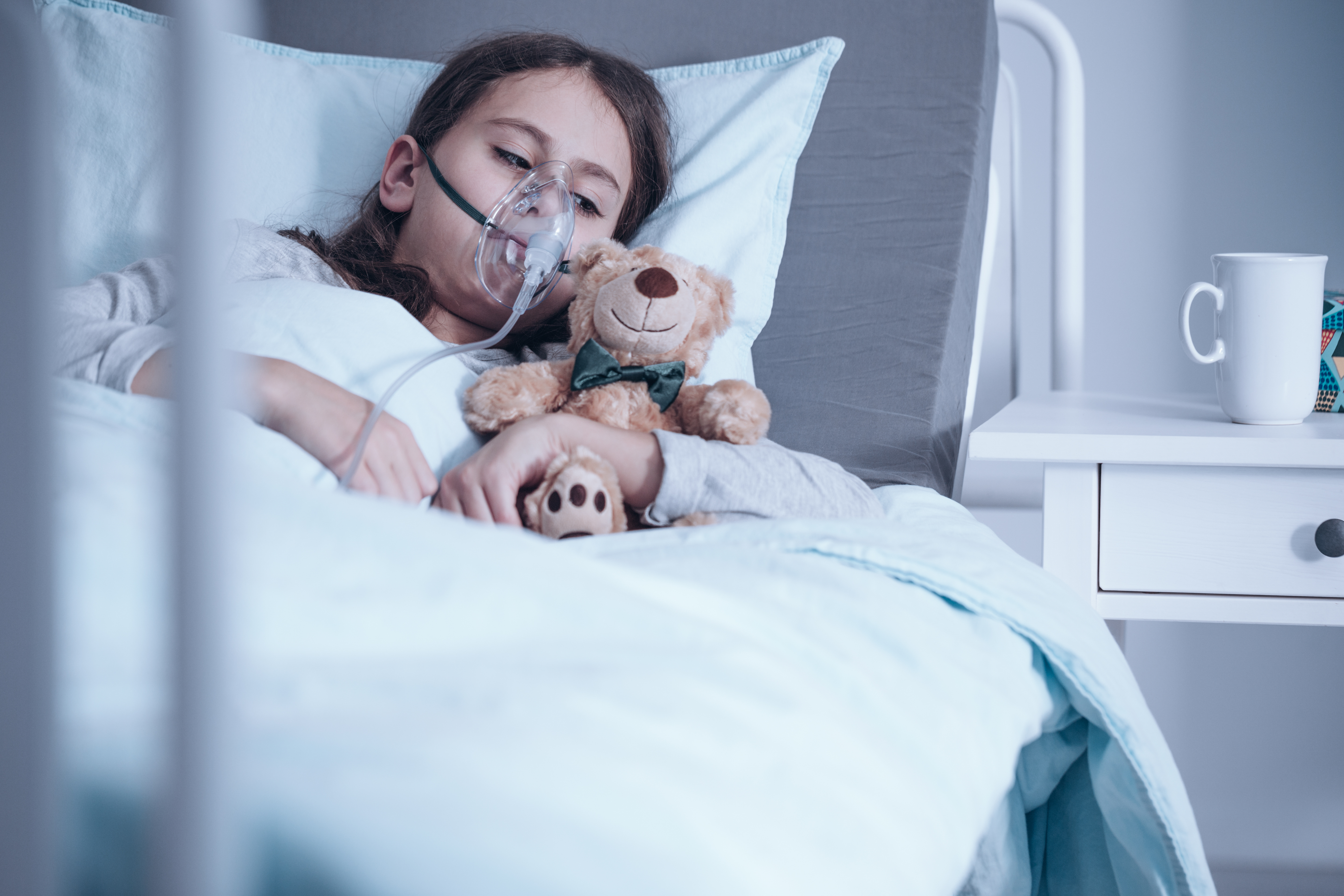 Young girl is lying in hospital bed | Source: Shutterstock.com
