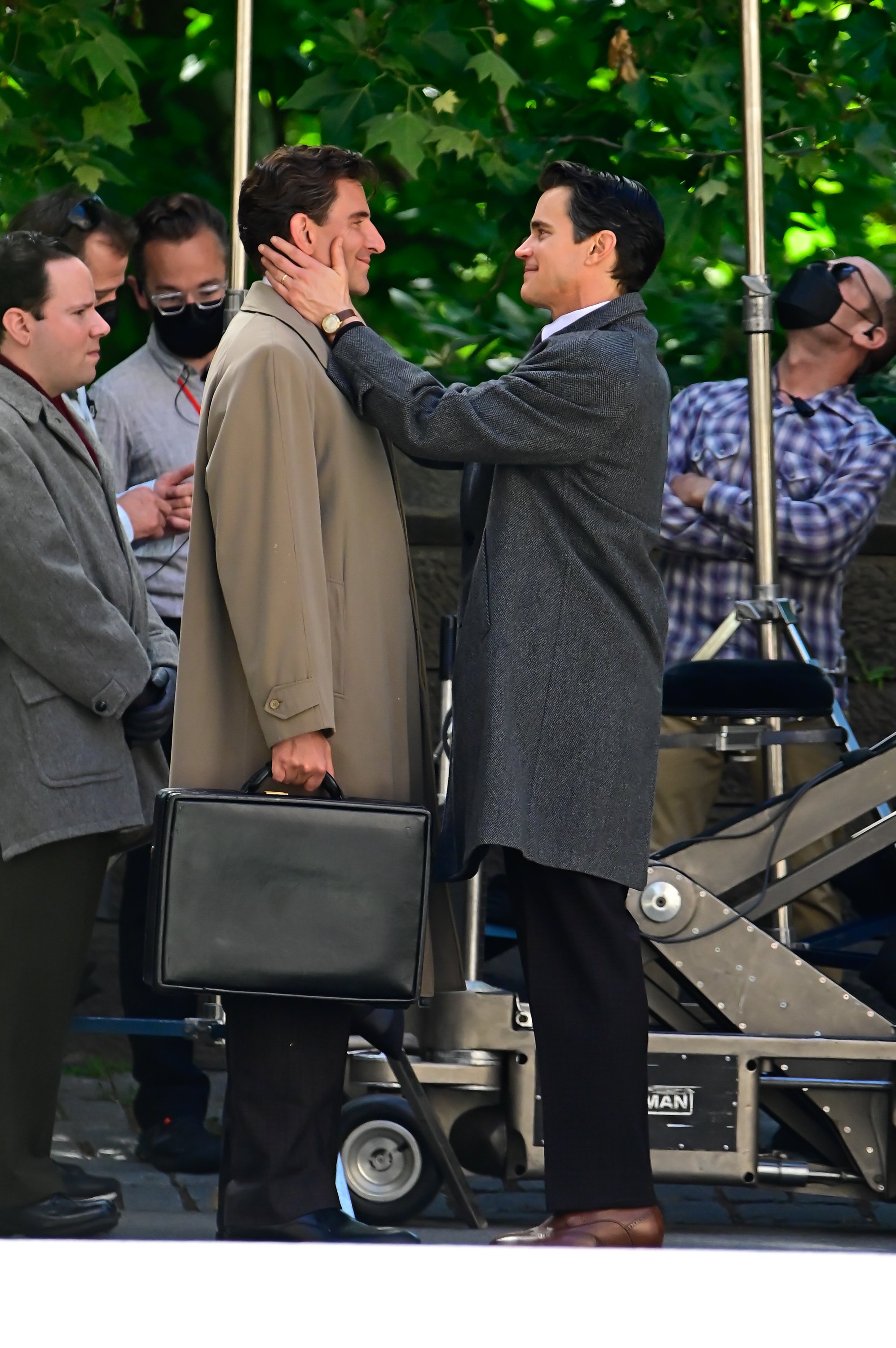 Matt Bomer and Bradley Cooper on the "Maestro" film set in Central Park on June 6, 2022 | Source: Getty Images