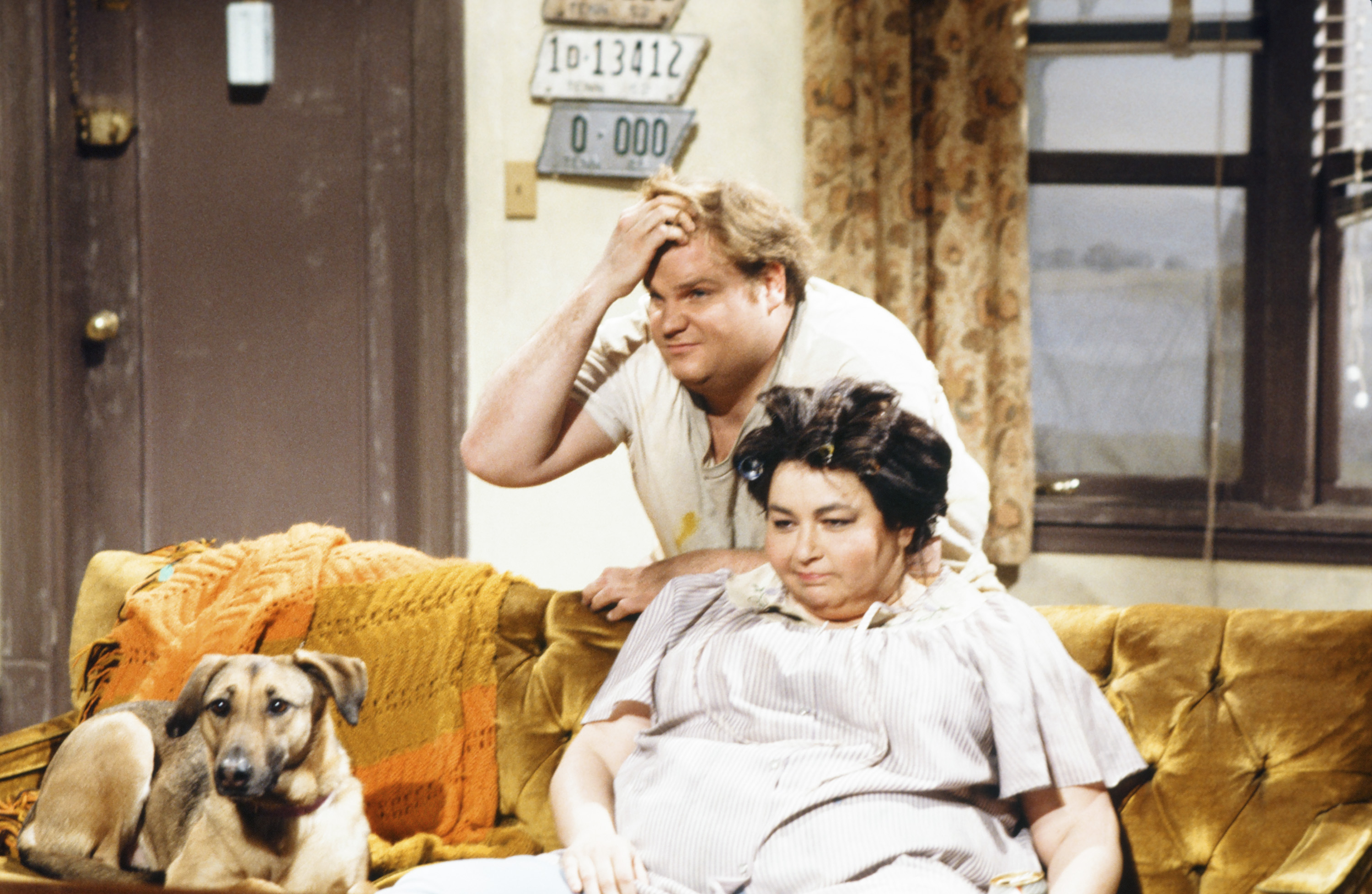 Chris Farley and Roseanne Barr in a skit called "White Trash History Minute" on February 16, 1991. | Source: Getty Images