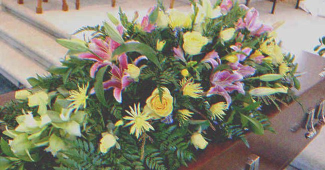 Flowers on top of a coffin | Source: Shutterstock