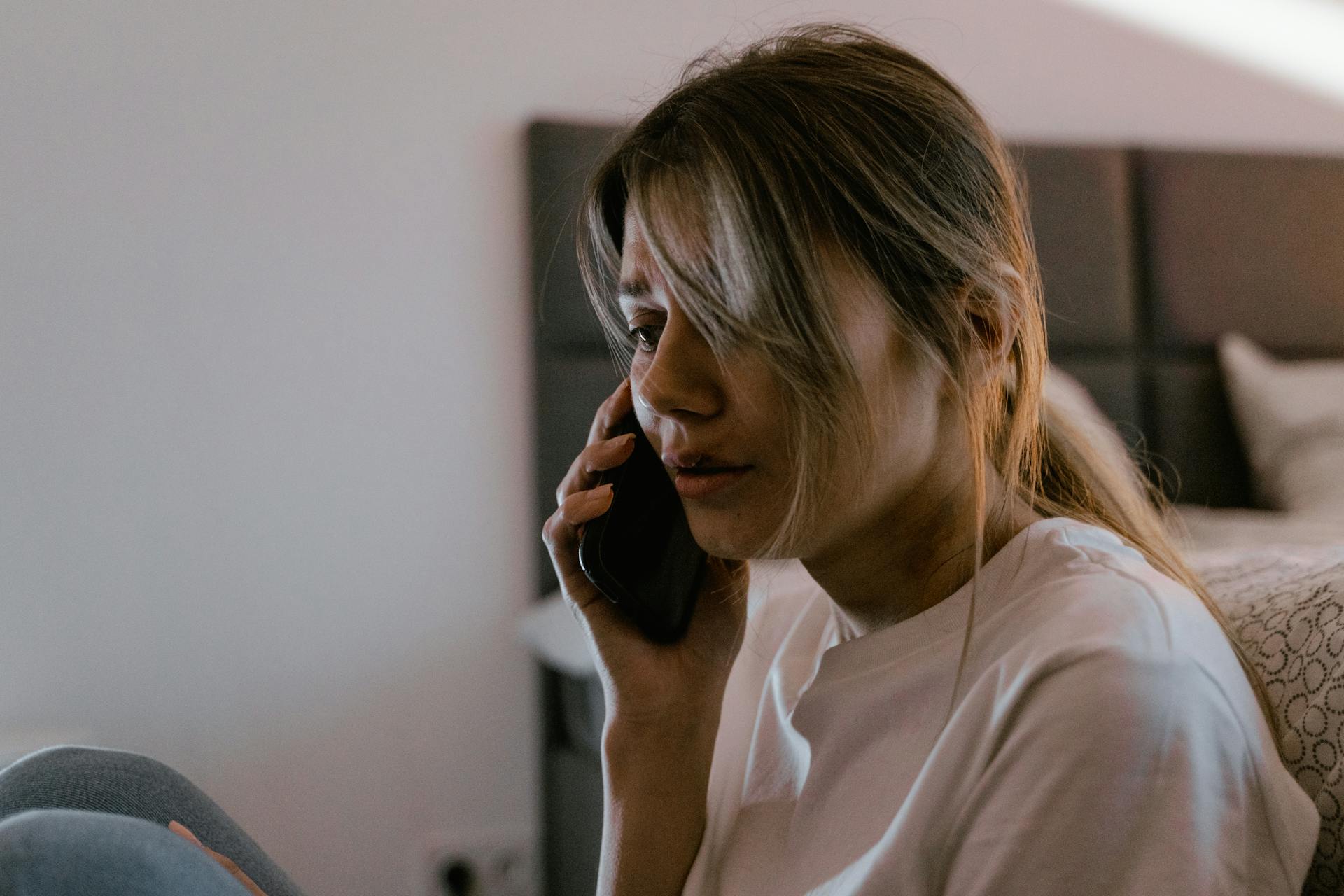 A young woman talking on her phone | Source: Pexels