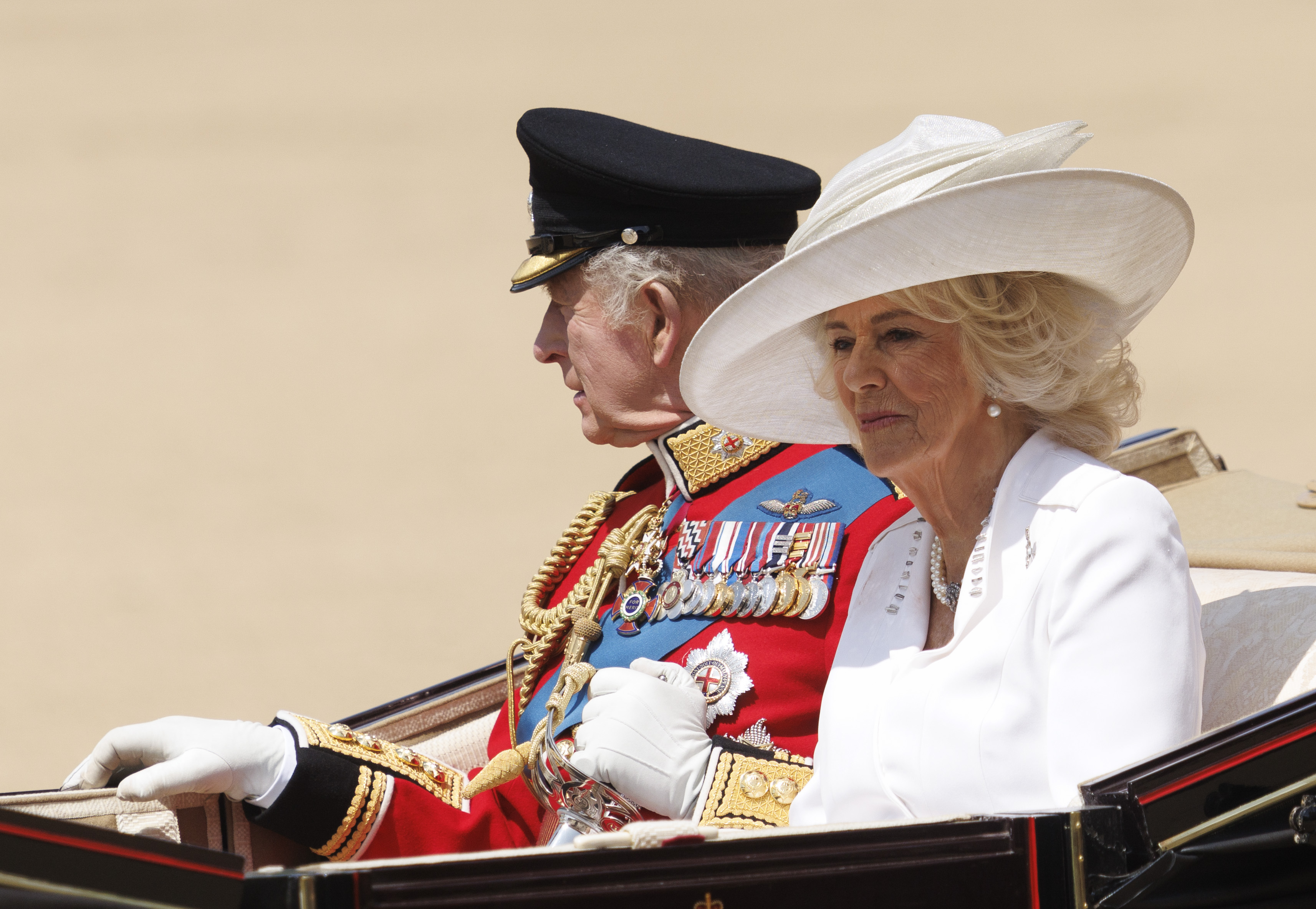 King Charles III and Queen Camilla riding in a carriage. | Source: Getty Images