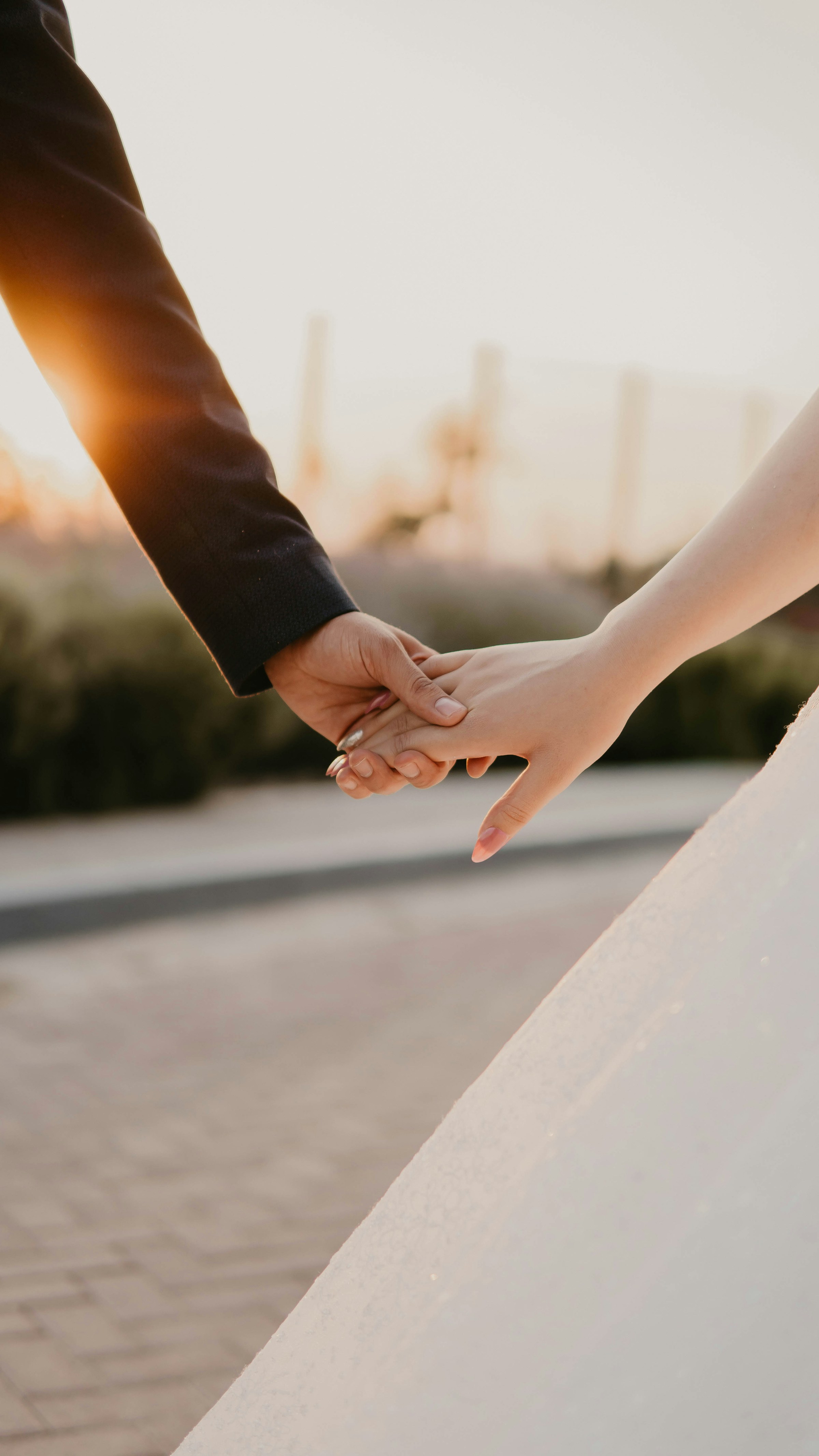 A bride and groom holding hands | Source: Unsplash