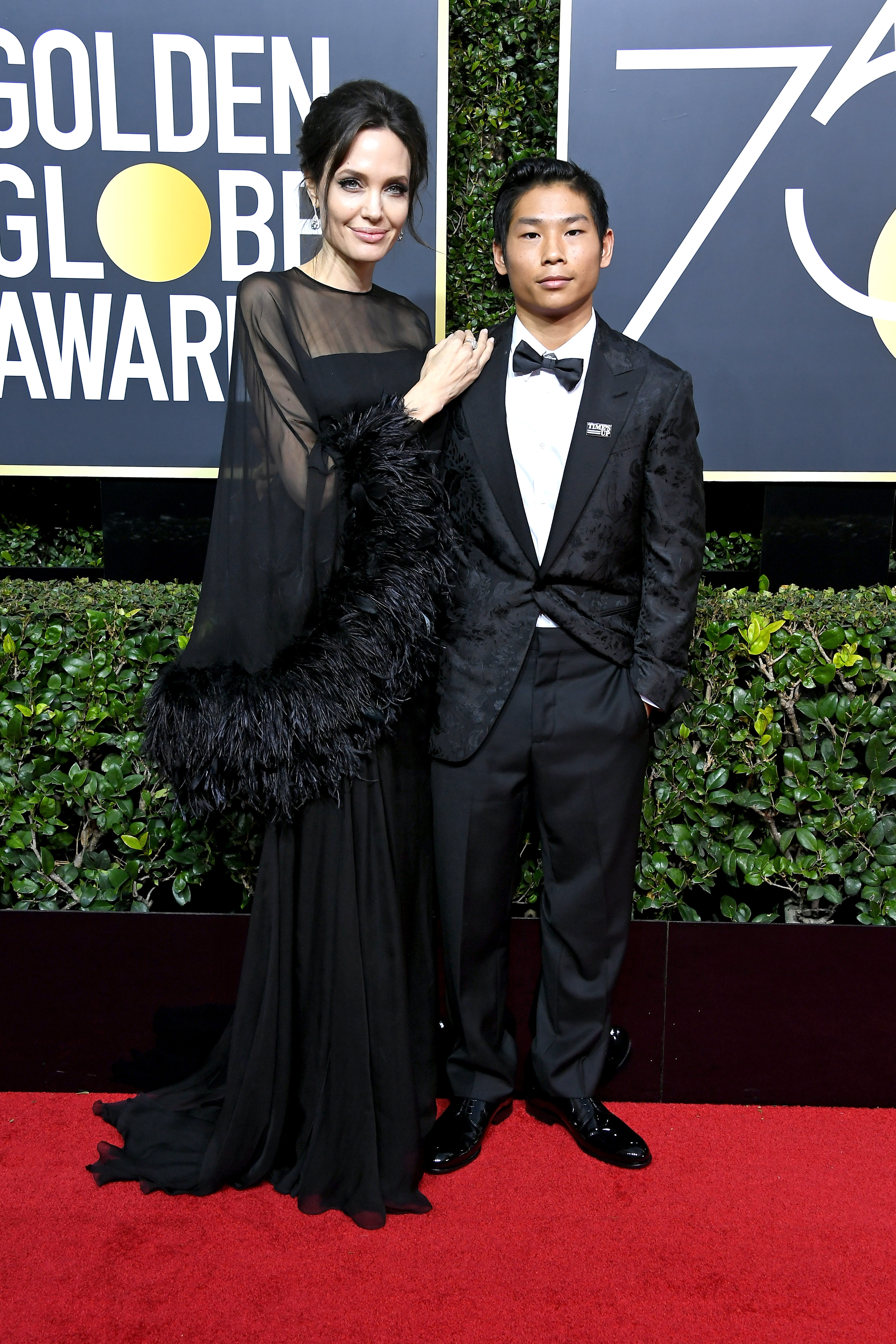 Angelina Jolie and Pax Jolie-Pitt at the 75th Annual Golden Globe Awards on January 7, 2018. | Source: Getty Images