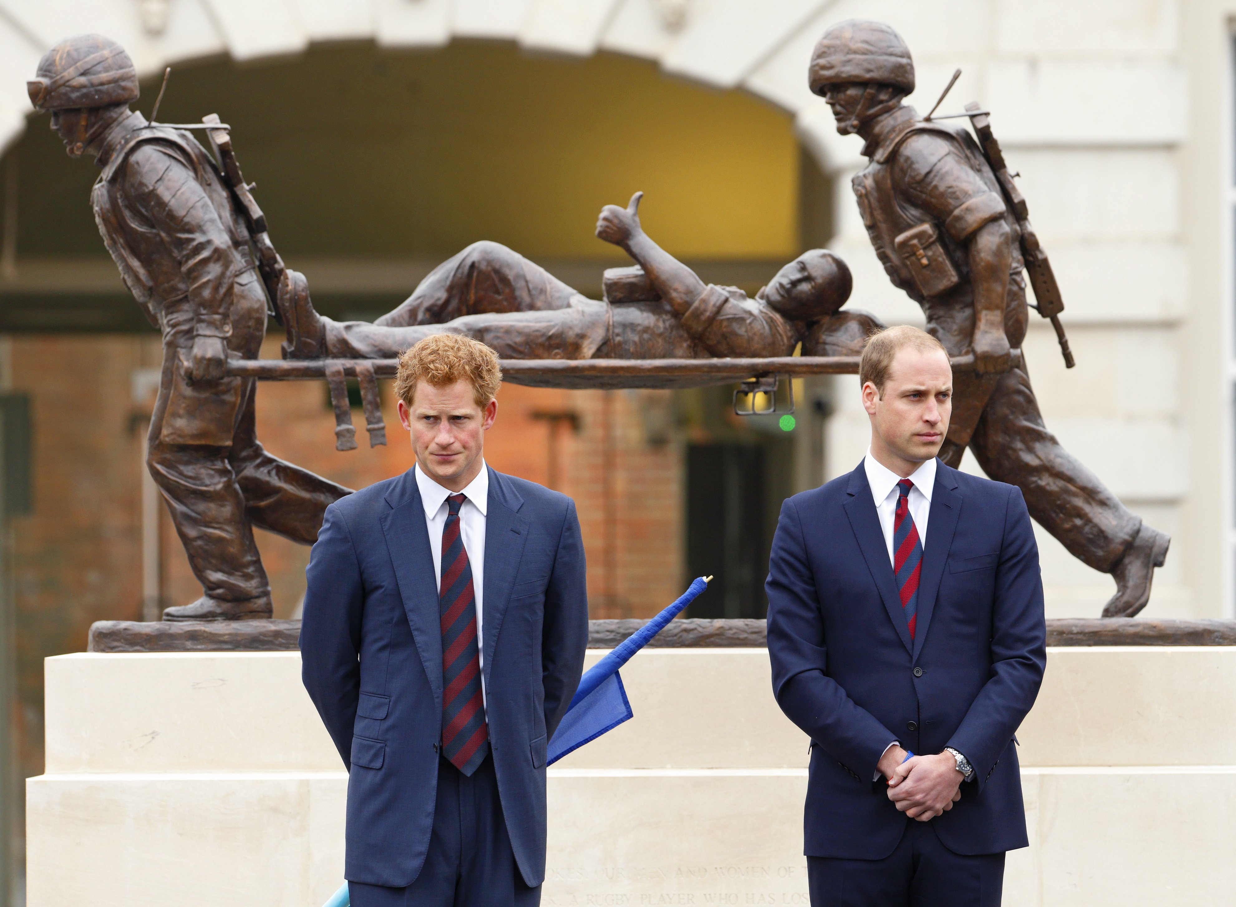 Prince Harry and Prince William standing in front of the Help for Heroes statue during the opening of the new Help for Heroes Recovery Centre at Tedworth House on May 20, 2013 in Tidworth, England. / Source: Getty Images